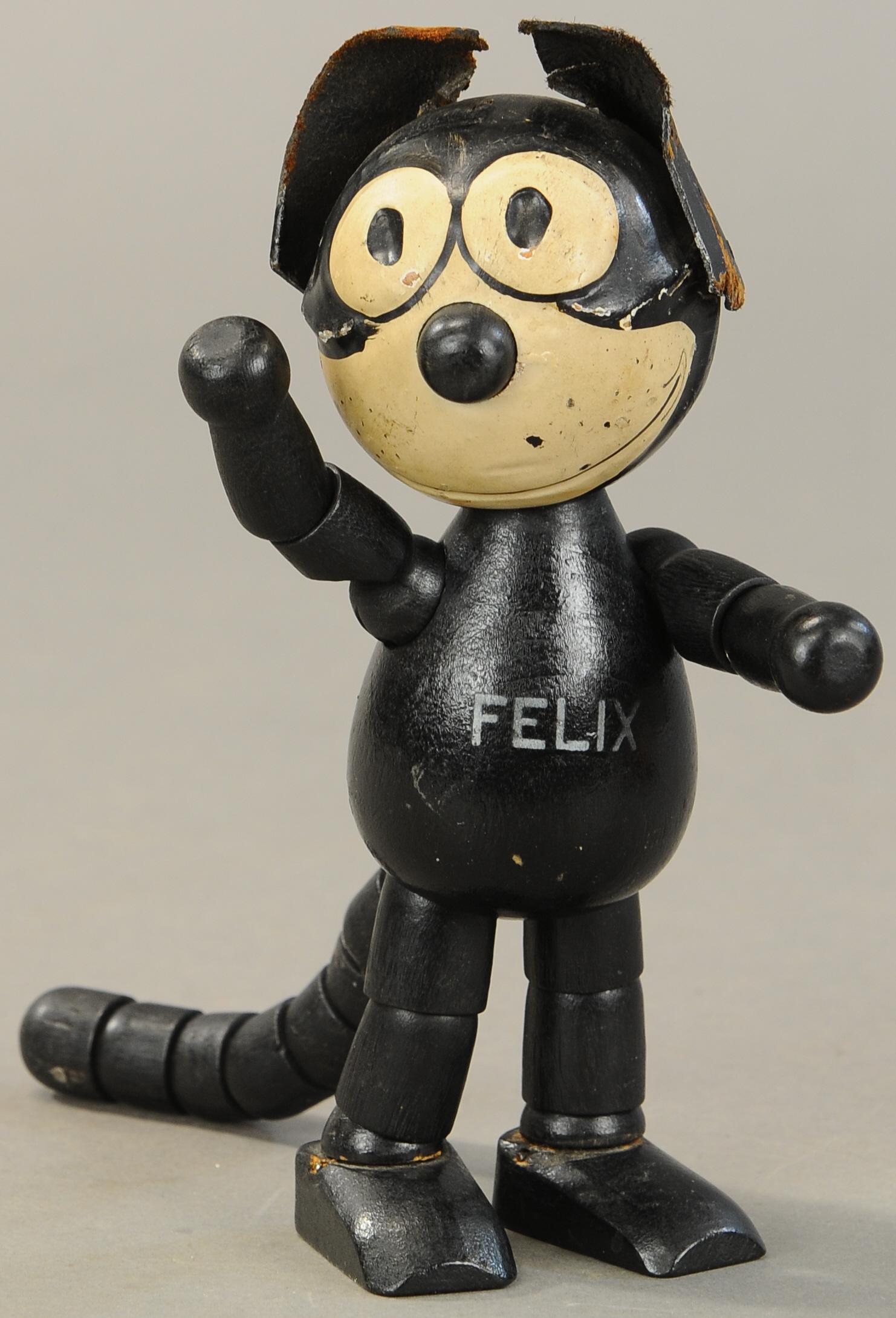 FELIX THE CAT WOODEN JOINTED DOLL: 1540. FELIX THE CAT WOODEN JOINTED DOLL | 8" h. | Wear at both ears and section of rear head, otherwise in (Exc. Cond.) | $200 - $400