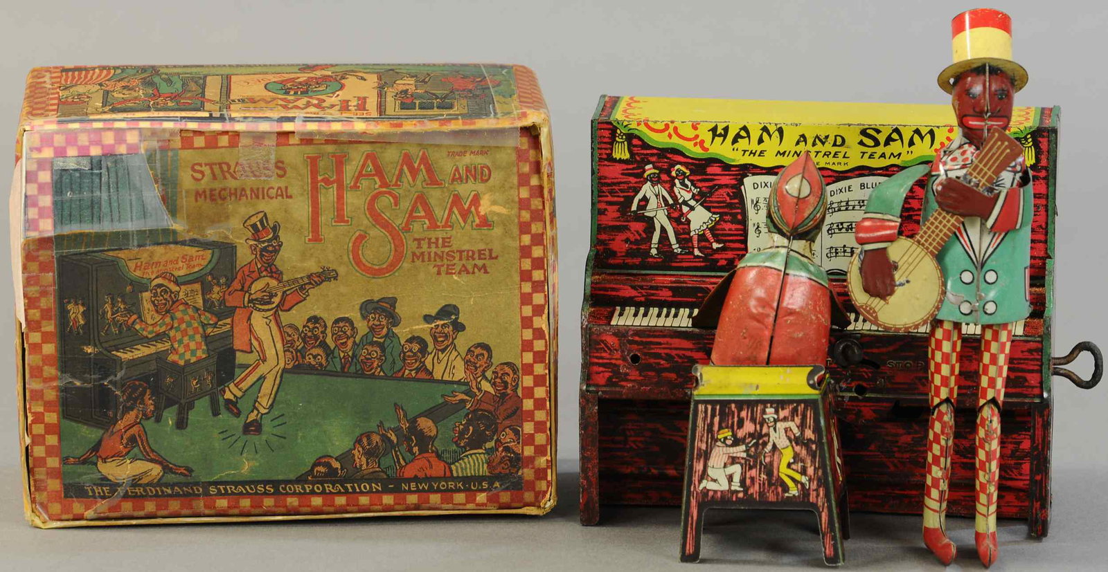 BOXED STRAUSS HAM & SAM BAND: 1552. BOXED STRAUSS HAM & SAM BAND | Hard to find box, 7" | Piano players arms replaced w/touch-up to body, box has some copied repair sections, wind-up not working, overall in (Exc. Cond.) | $300 - $