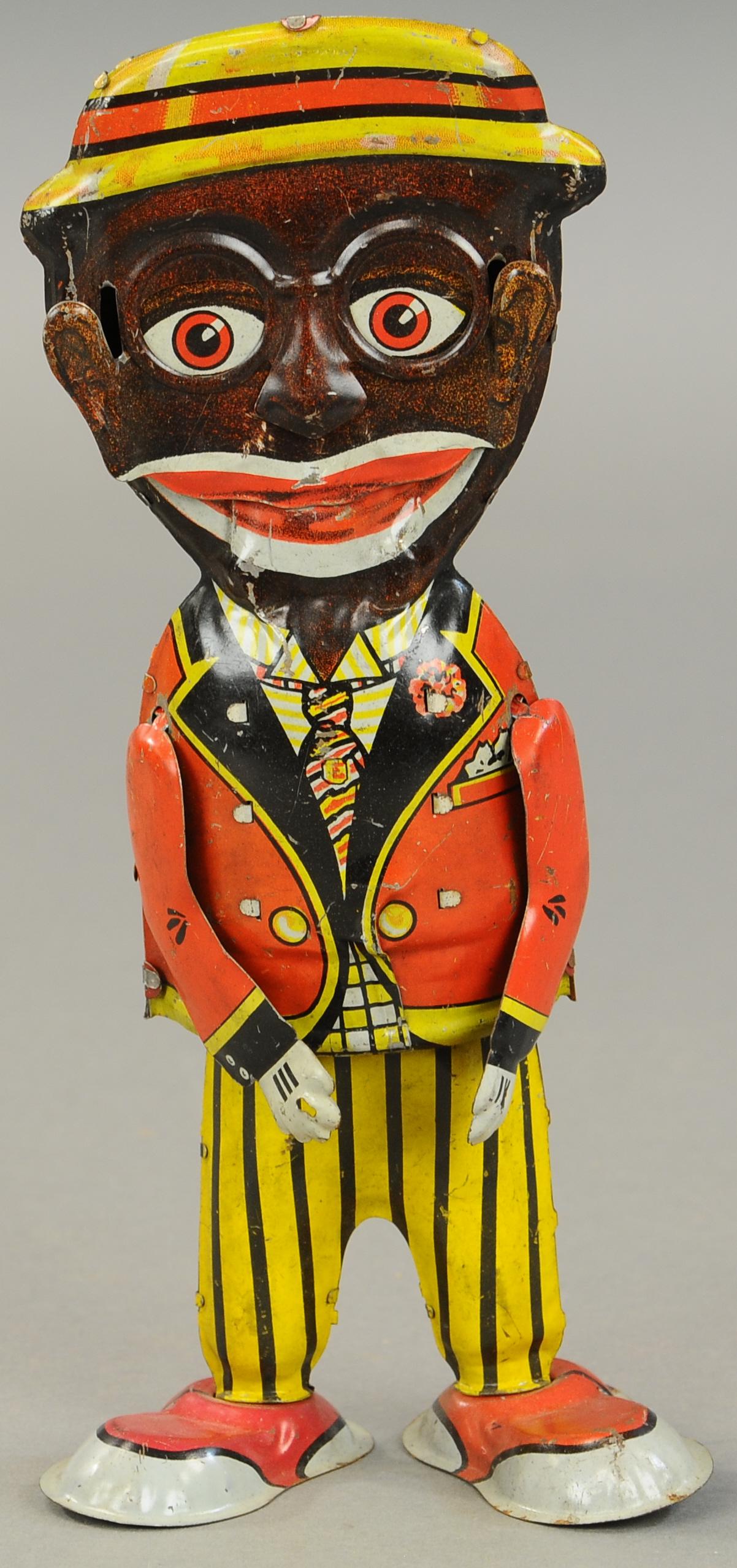 MARX MAMMY'S BOY WALKER: 1570. MARX MAMMY'S BOY WALKER | 11" h. | Missing his metal cane, otherwise original in (VG Cond.) | $400 - $600
