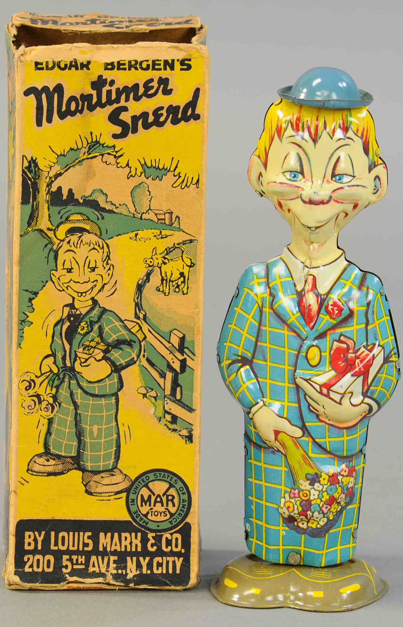 BOXED MARX MORTIMER SNERD WALKER: 1574. BOXED MARX MORTIMER SNERD WALKER | Nice lithographed box with depictions of Edgar Bergens comical Mortimer Snerd. 8.5" | (Pristine Cond.) | $300 - $500