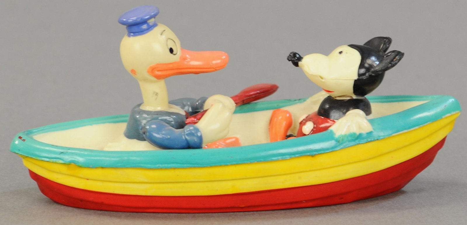 CELLULOID MICKEY & DONALD IN CANOE: 1620. CELLULOID MICKEY & DONALD IN CANOE | Relatively hard to find example. 6" | (Pristine Cond.) | $400 - $600