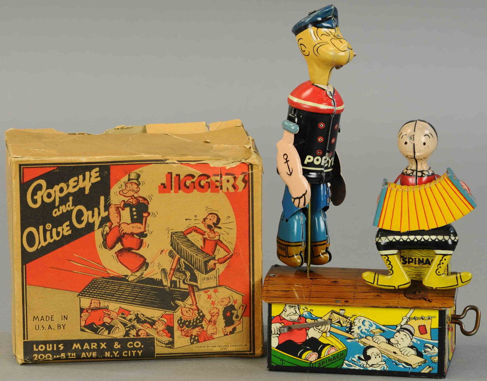 BOXED POPEYE AND OLIVE OYL JIGGERS: 1641. BOXED POPEYE AND OLIVE OYL JIGGERS | 10" | Box missing one end flap, other loose, (Pristine-Near Mint Cond.) | $800 - $1,200
