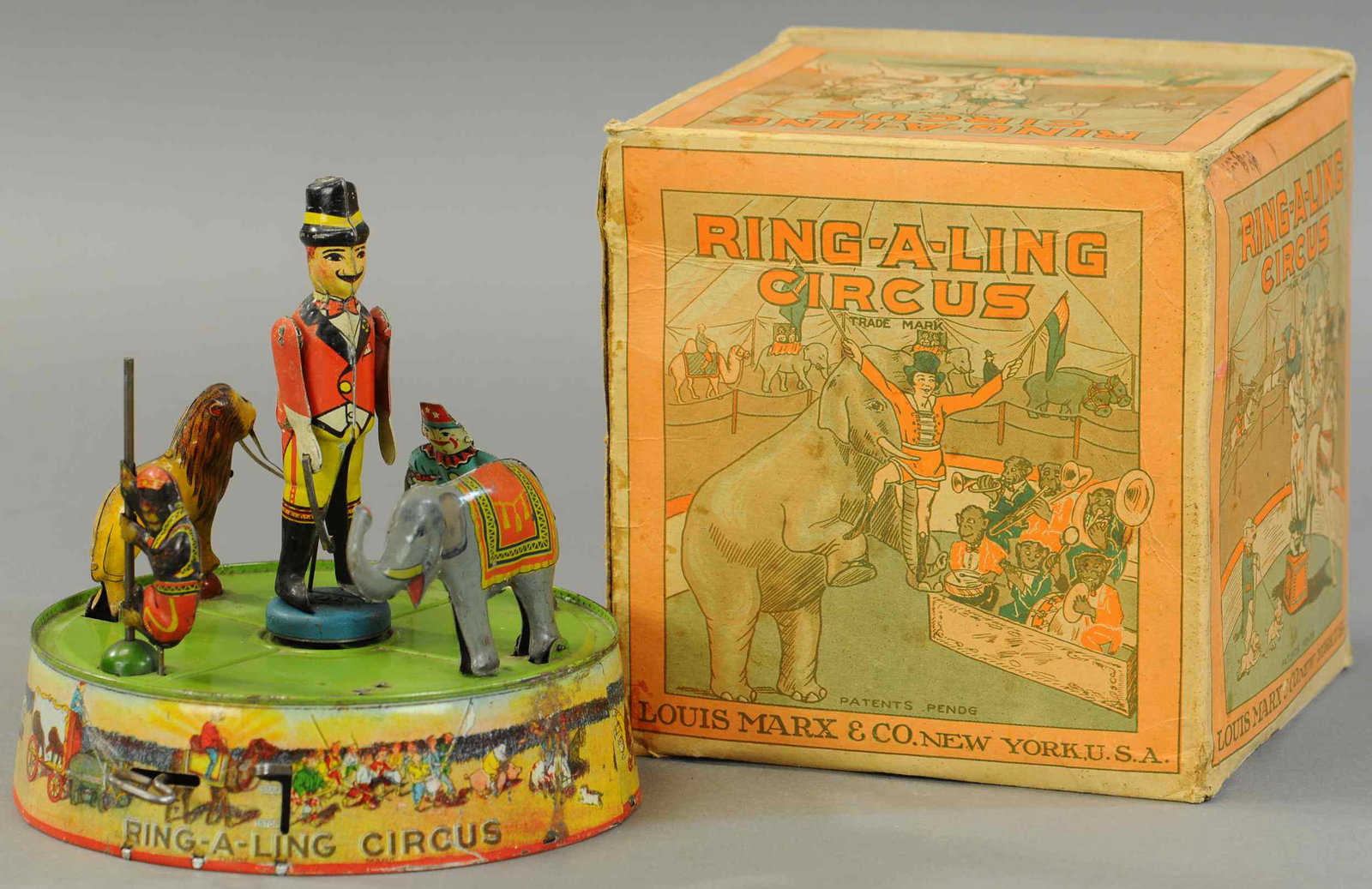 BOXED MARX RING-A-LING CIRCUS TOY: 1667. BOXED MARX RING-A-LING CIRCUS TOY | A very popular toy with original cardboard box. 8" diam. x 9" h. | (Exc. Cond.) | $500 - $750