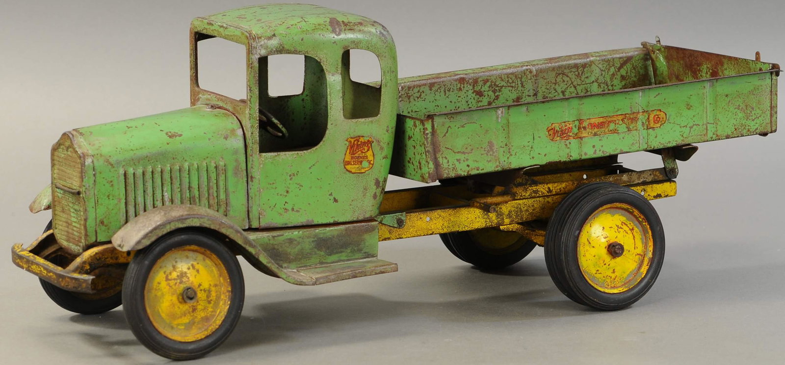 HOENES VIKING DUMP TRUCK: 1777. HOENES VIKING DUMP TRUCK | A hard to come by truck. 27" l. | Appears original with significant playwear, (VG Cond.) | $1,000 - $1,500