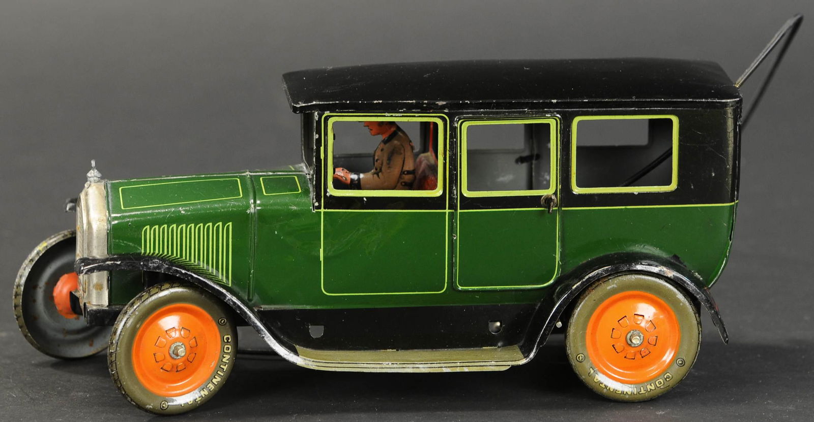 BING HAND STEERING PNEUMATIC AUTO: 2013. BING HAND STEERING PNEUMATIC AUTO | Wind-up rear axle with hand plunger on flexible wire to straighten and/or adjust steering. 11" l. | (Pristine Condition) | $700 - $1,000 | Provenance: Sam Dow