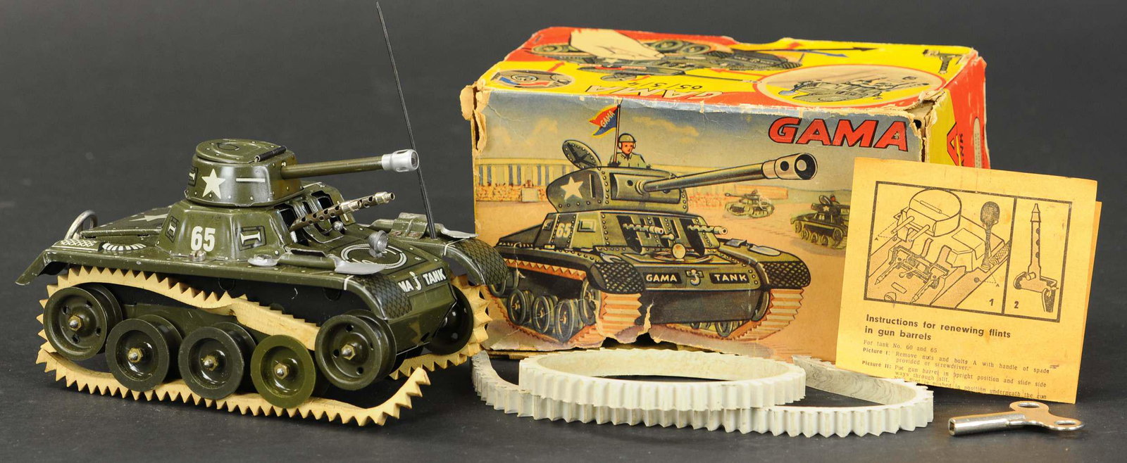 BOXED GAMA MONTAGE TANK: 2038. BOXED GAMA MONTAGE TANK | Complete with tools, parts, and instructions. 6.5" l. | Box in (Very Good Condition), Toy has original treads but are dry and split, working in (Pristine Condition) | $
