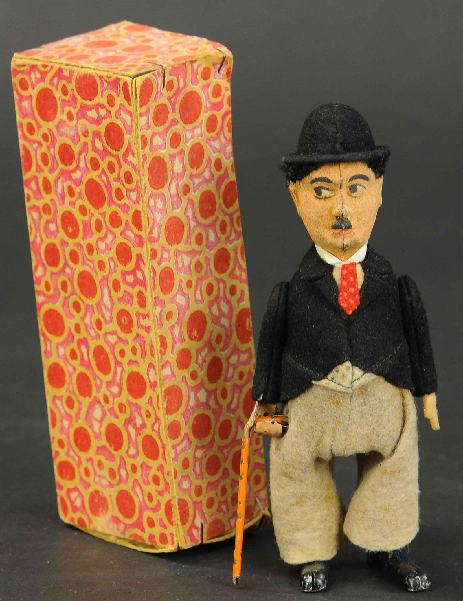 SCHUCO CHARLIE CHAPLIN: 2061. SCHUCO CHARLIE CHAPLIN | Includes bottom portion of box. 7" l. | (Very Good to Excellent Condition) | $400 - $600 | Provenance: Sam Downey Collection.