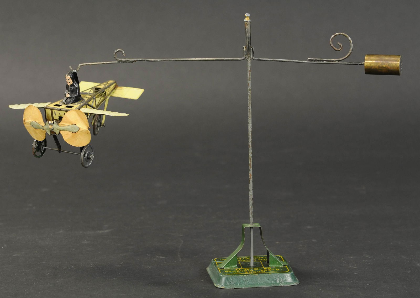 GUNTHERMANN BLERIOT GO-AROUND: 2067. GUNTHERMANN BLERIOT GO-AROUND | Includes two metal poles, one original and one extra, sweet size plane. 12" l. | (Excellent Condition) | $1,500 - $2,500 | Provenance: Sam Downey Collection.