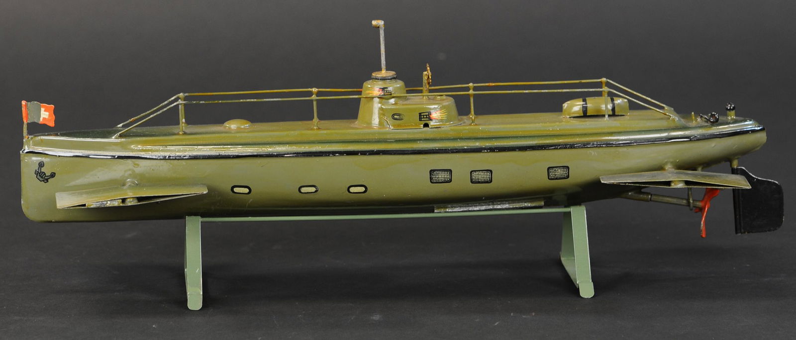 MEDIUM MARKLIN SUBMARINE: 2081. MEDIUM MARKLIN SUBMARINE | Middle of a series of sizes made by Marklin. 16" l. | Replaced cradle, otherwise all original (Pristine to Near Mint Condition) | $3,000 - $5,000 | Provenance: Sam Dow
