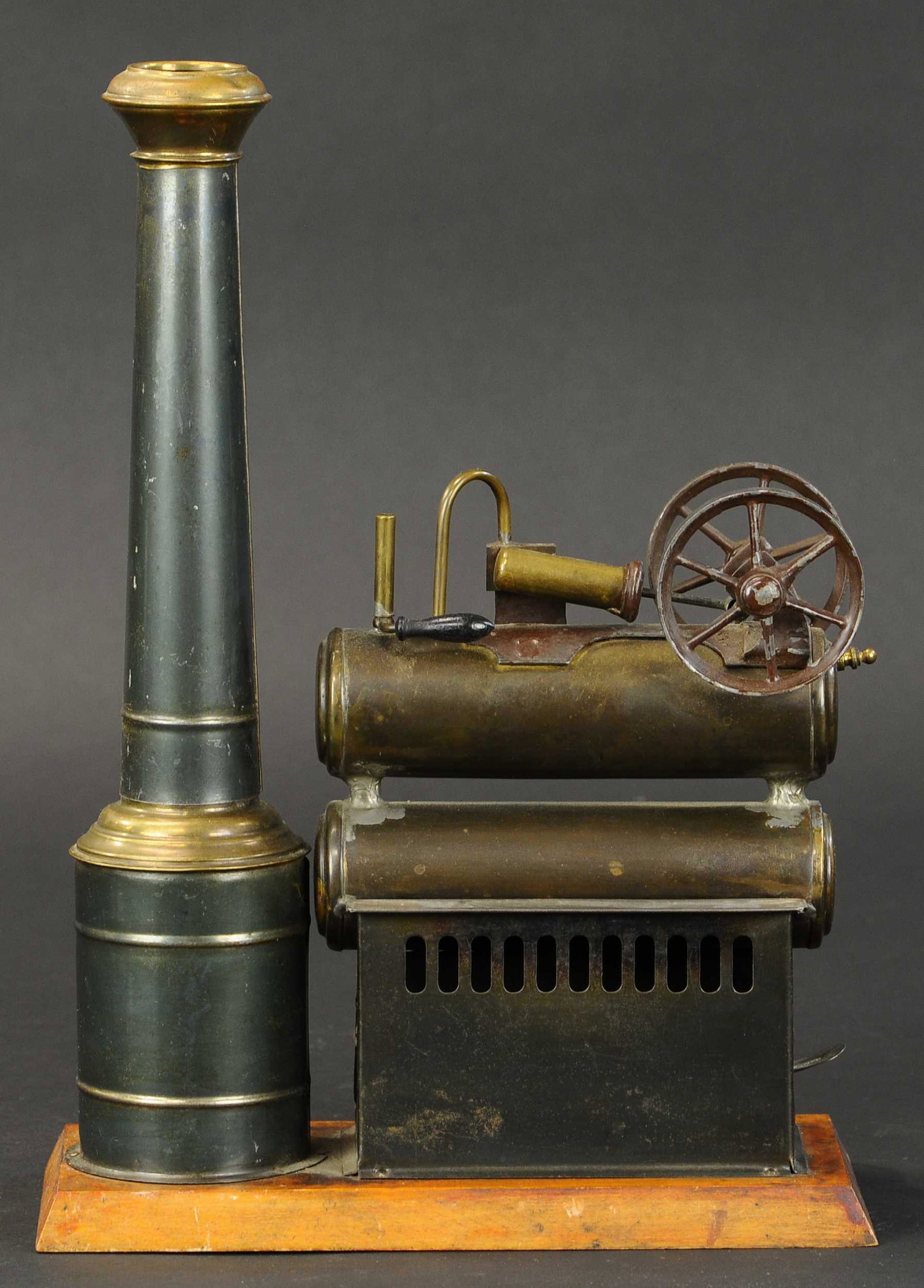 DOUBLE BOILER STEAM ENGINE: 2100. DOUBLE BOILER STEAM ENGINE | Unusual engine features a doubled boiler section. 14" h. | Re-solder at boilers, overall (Excellent Condition) | $1,000 - $1,500 | Provenance: Sam Downey Collection.