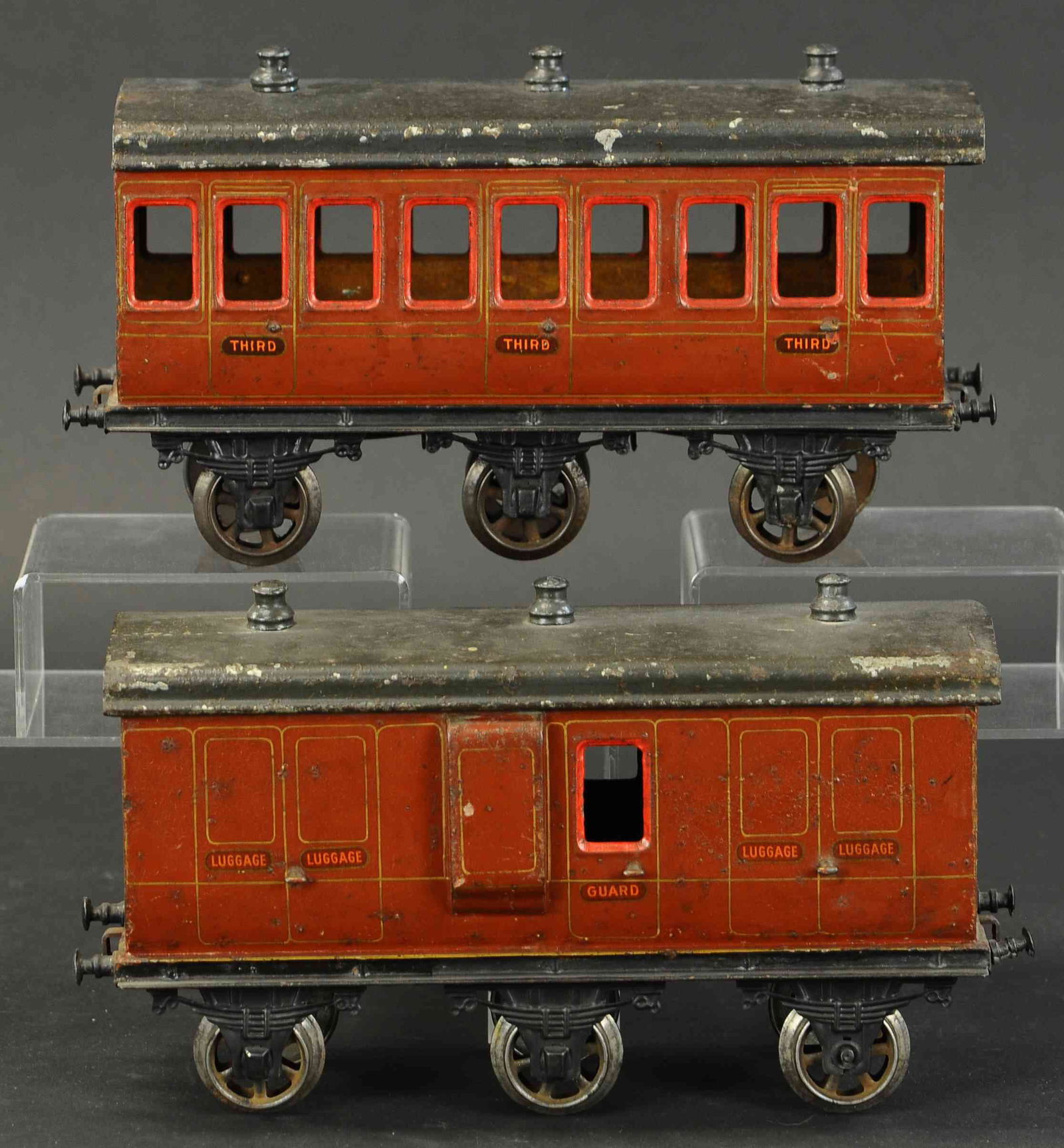 TWO BING GAUGE III CLEMSON COACHES: 2134. TWO BING GAUGE III CLEMSON COACHES | Gauge 3. 11.5" l. | One car trucks likely added, otherwise in (Very Good Condition) | $500 - $750 | Provenance: Sam Downey Collection.