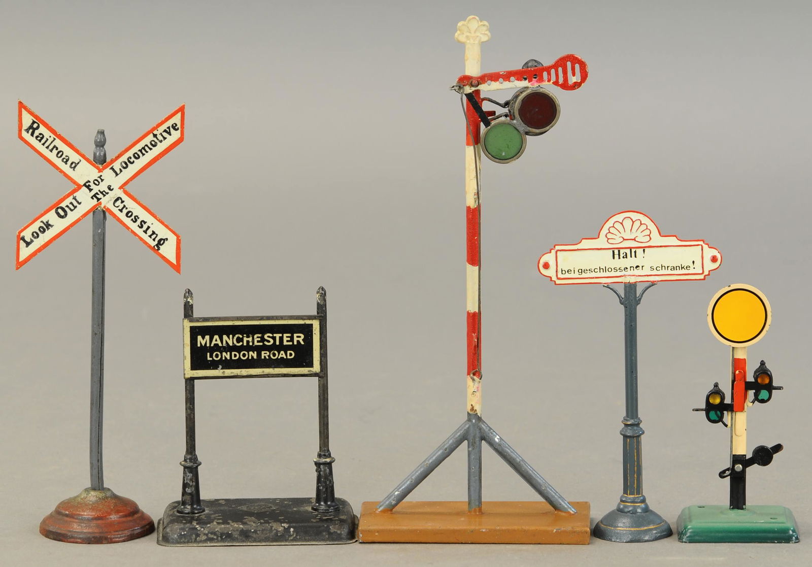 MARKLIN AND BING SIGNALS AND SIGNS: 2139. MARKLIN AND BING SIGNALS AND SIGNS | 9.5" h. | One sign and small semaphore repainted, others in (Very Good to Excellent Condition) | $300 - $600 | Provenance: Sam Downey Collection.