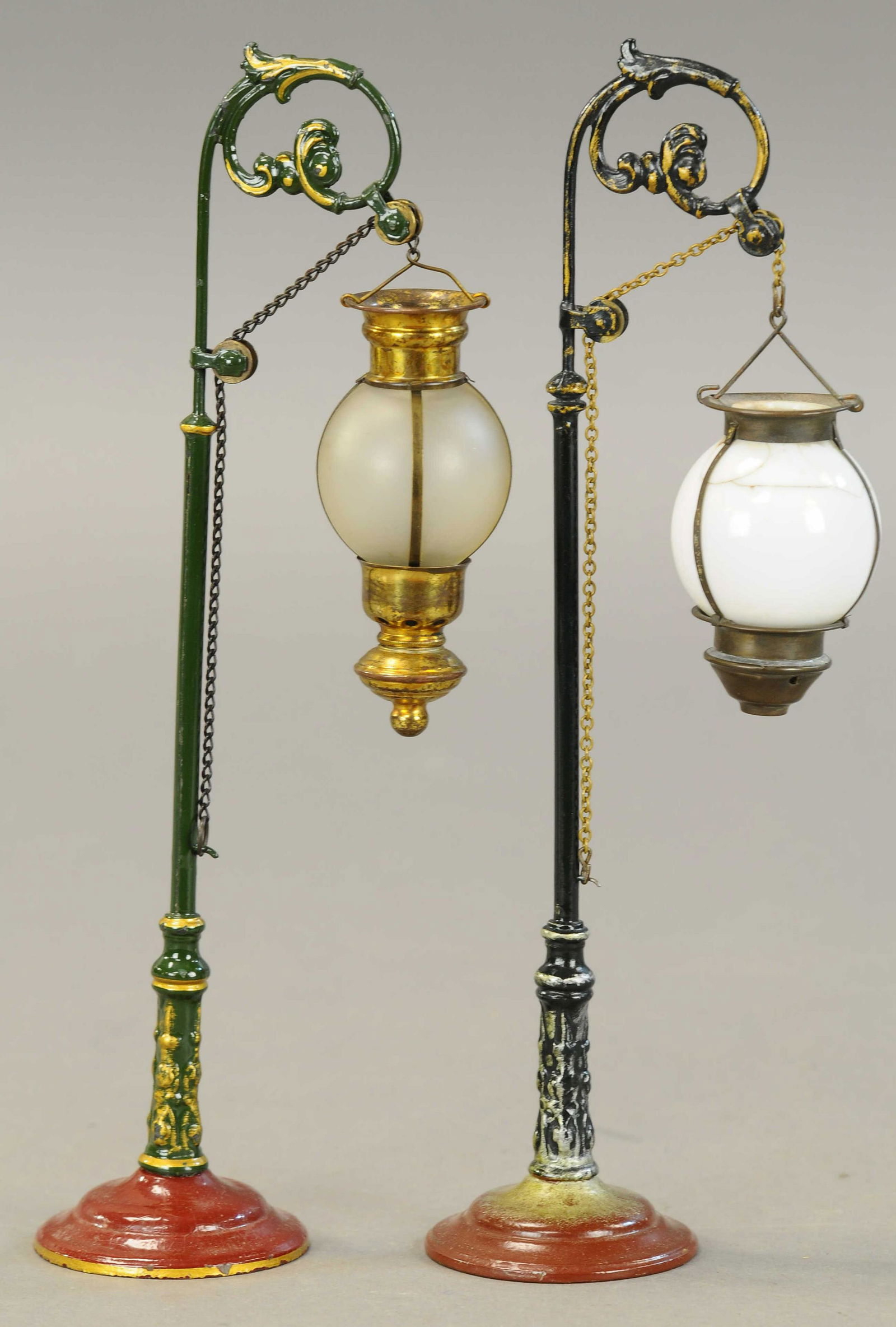 PAIR OF MARKLIN STREET LAMPS: 2147. PAIR OF MARKLIN STREET LAMPS | 12" h. | Paint on both appear to be restored and varnished. | $500 - $800 | Provenance: Sam Downey Collection.