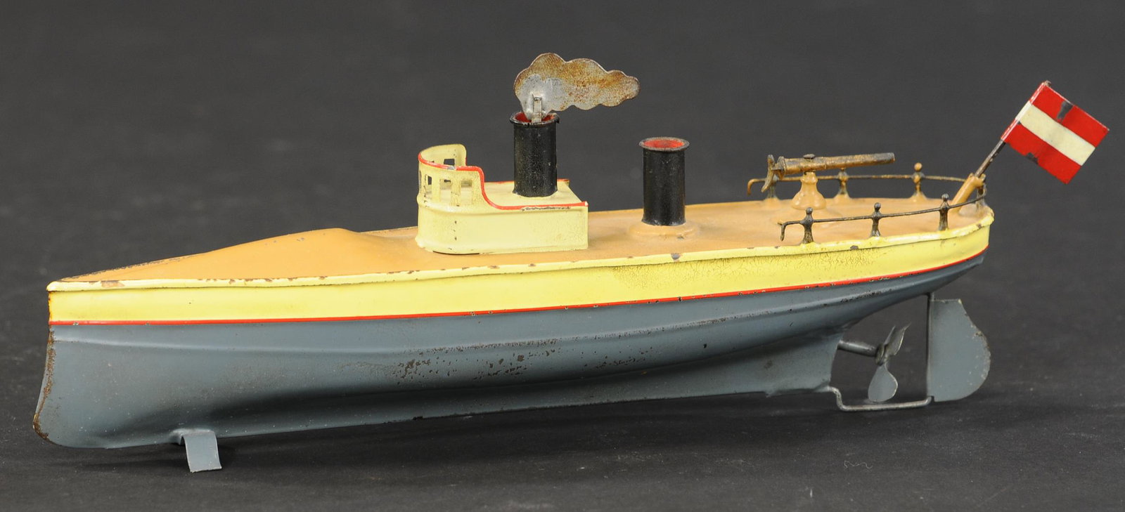 SMALL FLEISCHMANN TORPEDO BOAT: 2176. SMALL FLEISCHMANN TORPEDO BOAT | Wind-up coastal cruiser style boat. 9.5" l. | Restored. | $500 - $750 | Provenance: Sam Downey Collection.