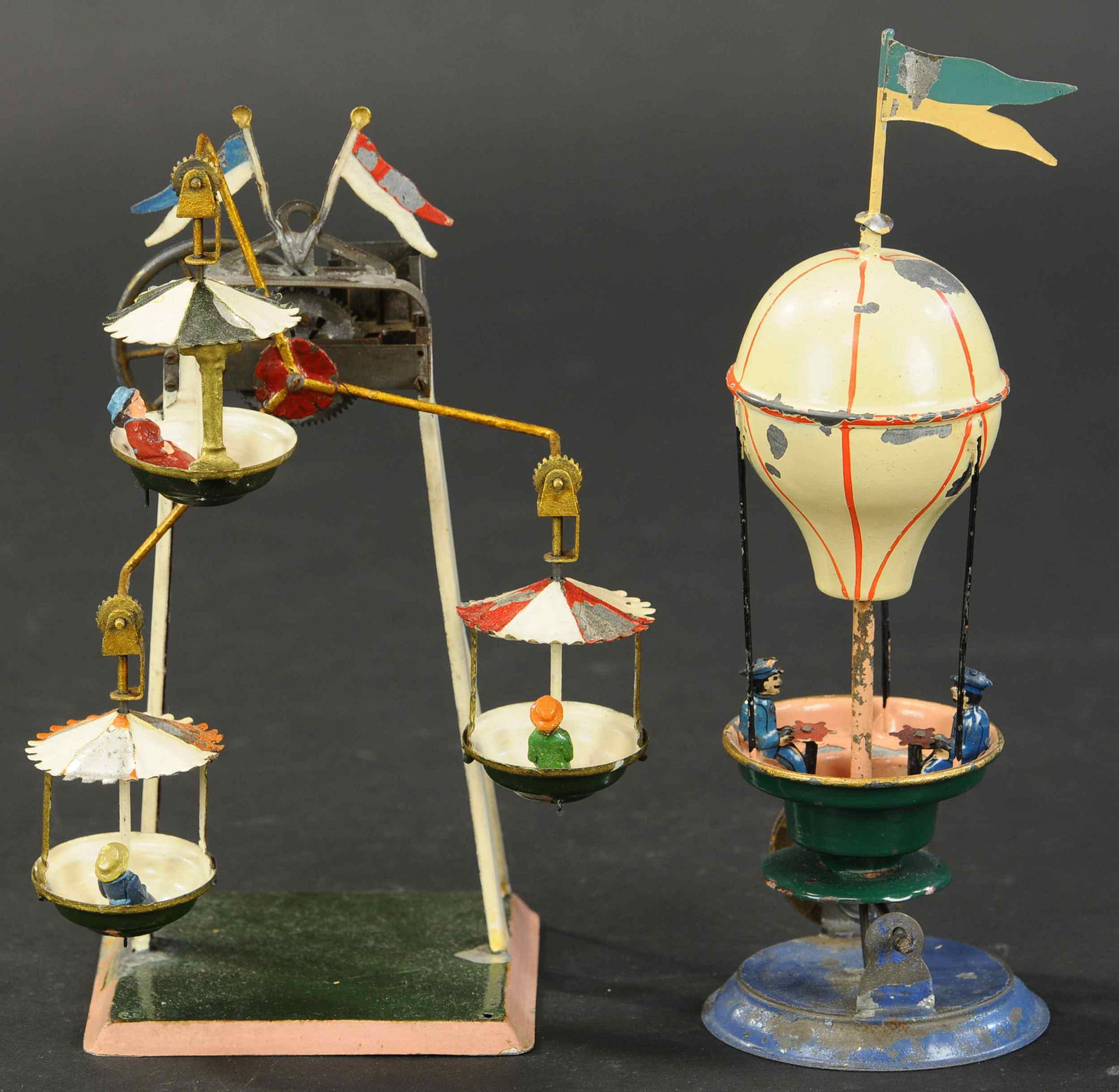 AIR BALLOON & FERRIS WHEEL STEAM TOYS: 2207. AIR BALLOON & FERRIS WHEEL STEAM TOYS | 9" | One post of Ferris Wheel reconnected to base, otherwise paint on each in (Very Good to Excellent Condition) | $600 - $1,000 | Provenance: Sam Downey 