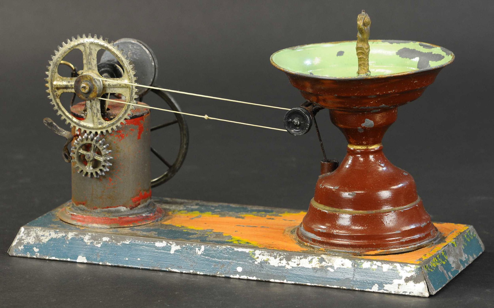 EARLY MECHANICAL WATER FOUNTAIN: 2216. EARLY MECHANICAL WATER FOUNTAIN | 13" | (Very Good Condition) | $300 - $500 | Provenance: Sam Downey Collection.