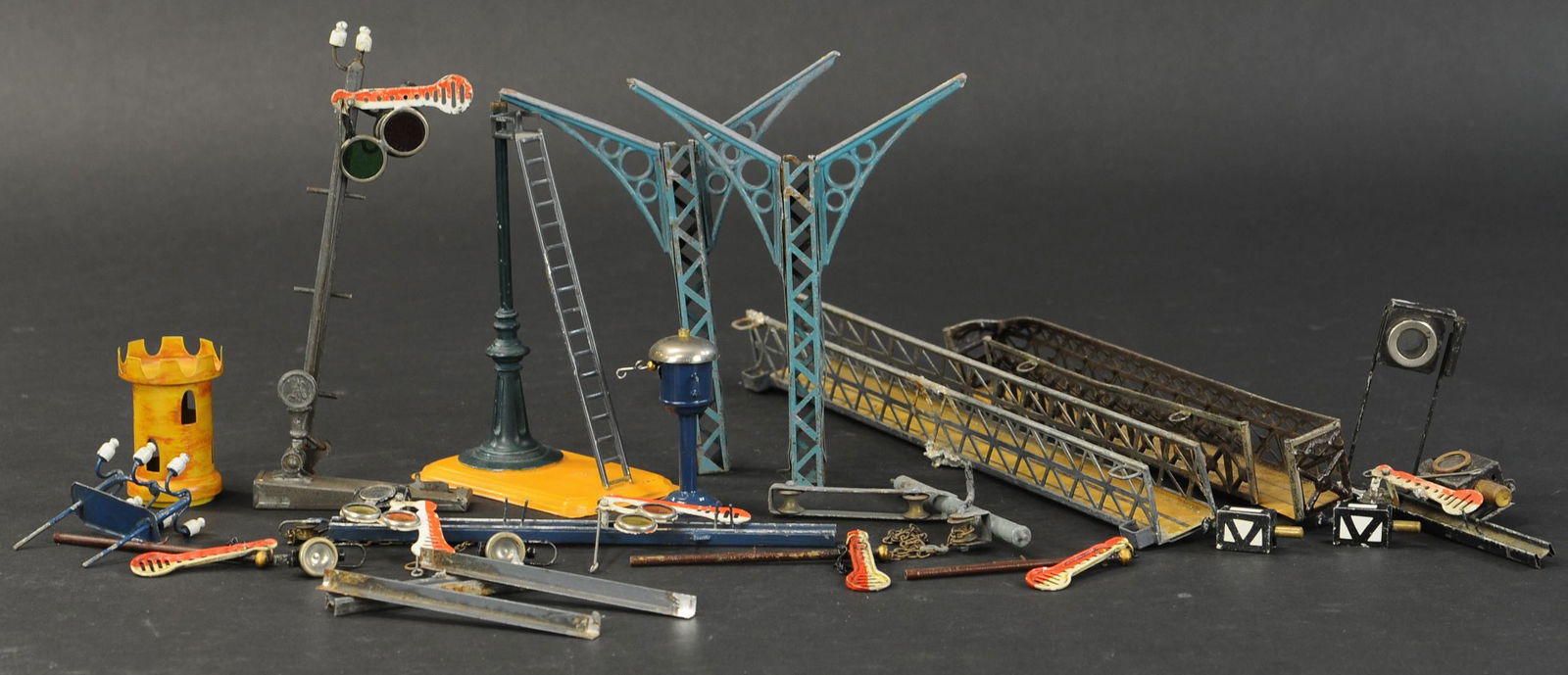 MARKLIN TRAIN ACCESSORY PARTS LOT: 2297. MARKLIN TRAIN ACCESSORY PARTS LOT | Large lot of original and new Marklin accessory parts; lamp posts, footbridges, signals, insulators, etc.. 3" - 14" h. | As noted, sold as-is. | $300 - $600 |