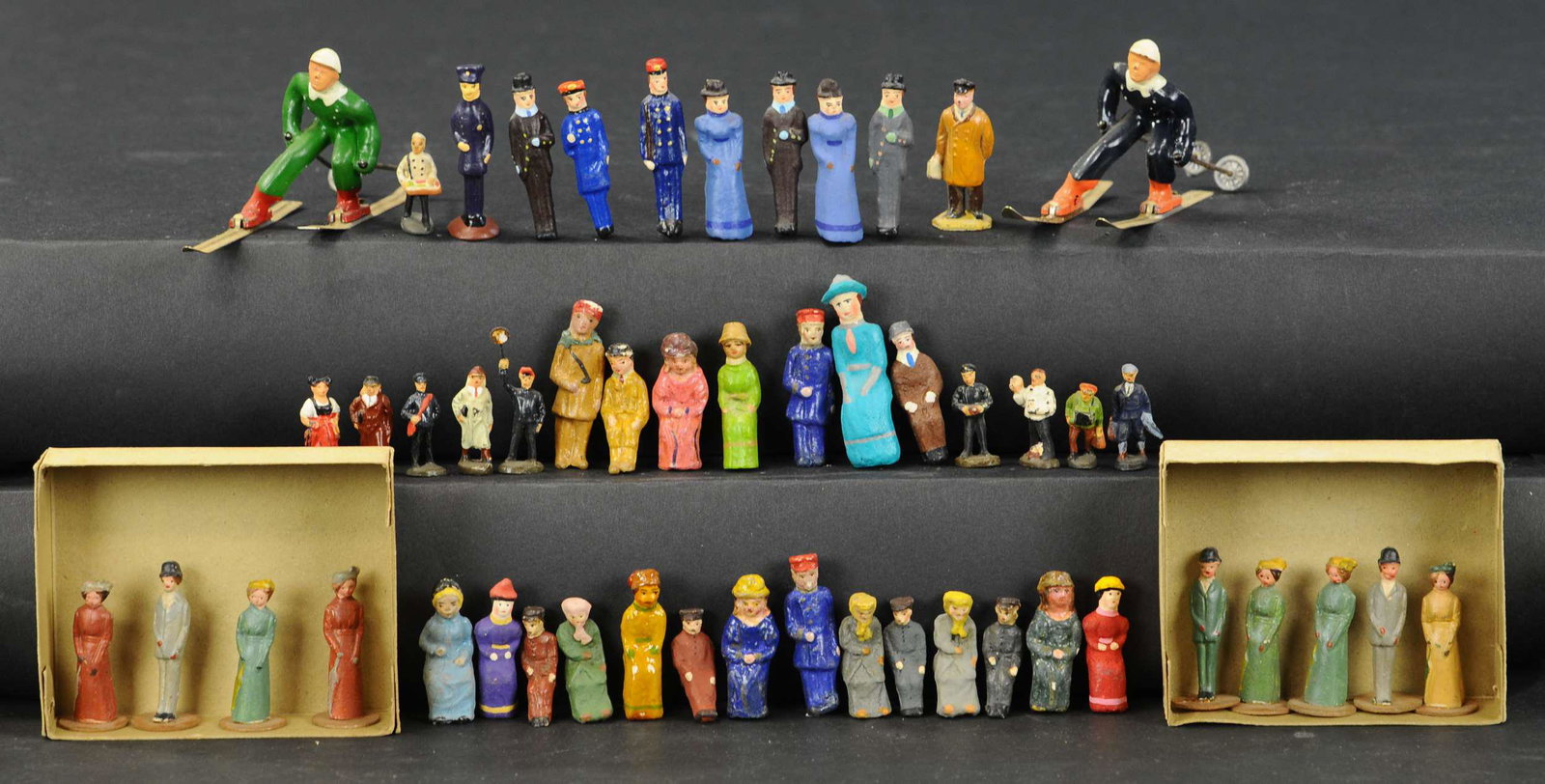 LARGE ASSORTMENT OF COMPOSITION FIGURES: 2303. LARGE ASSORTMENT OF COMPOSITION FIGURES | Mixed sizes and styles, includes some original and some replacements. 1.5" - 2.25" h. | As noted, sold as-is. | $400 - $800 | Provenance: Sam Downey Col