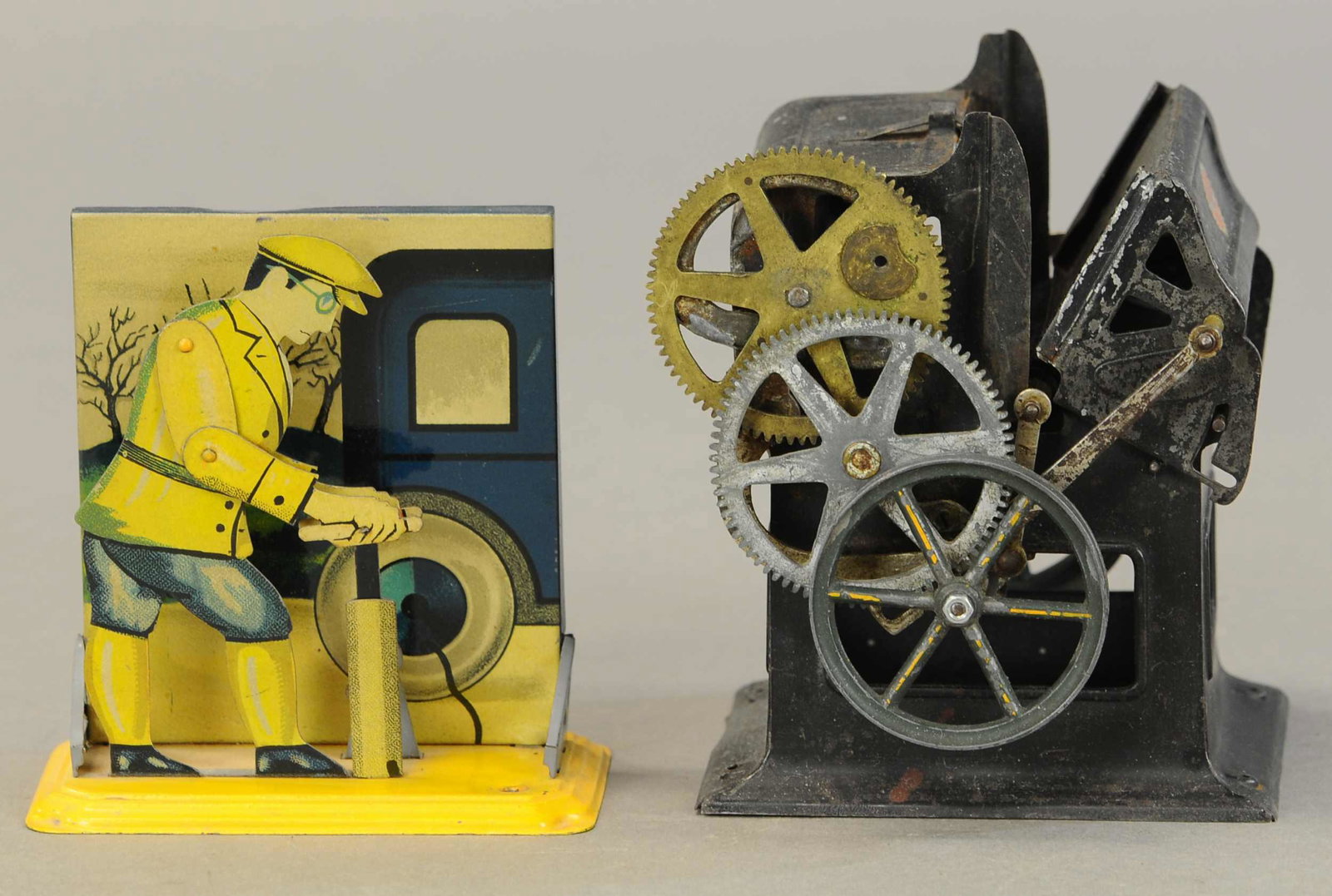 BING TIRE PUMPER & PRINT PRESS ACCESSORY: 2324. BING TIRE PUMPER & PRINT PRESS ACCESSORY | Lot includes a Bing man pumping flat tire on his car and a Carette printing press, both steam accessories. 6: h.. | (Very Good to Excellent Condition) 