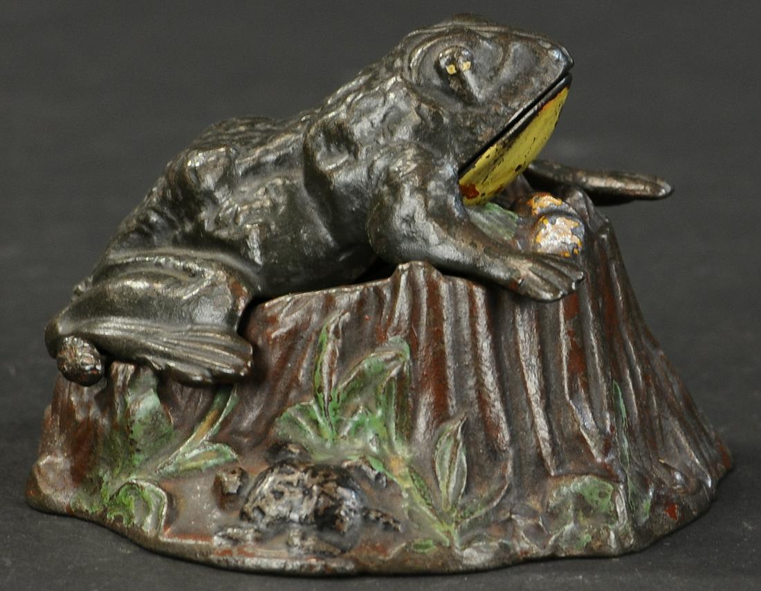 TOAD ON STUMP MECHANICAL BANK: 2357. TOAD ON STUMP MECHANICAL BANK | (Very Good to Excellent Condition) | $500 - $750 | Provenance: Sam Downey Collection.