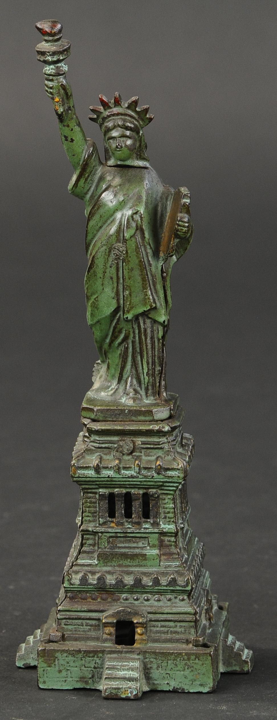 LARGE STATUE OF LIBERTY STILL BANK: 2361. LARGE STATUE OF LIBERTY STILL BANK | 10" h. | (Very Good to Excellent Condition) | $400 - $600 | Provenance: Sam Downey Collection.