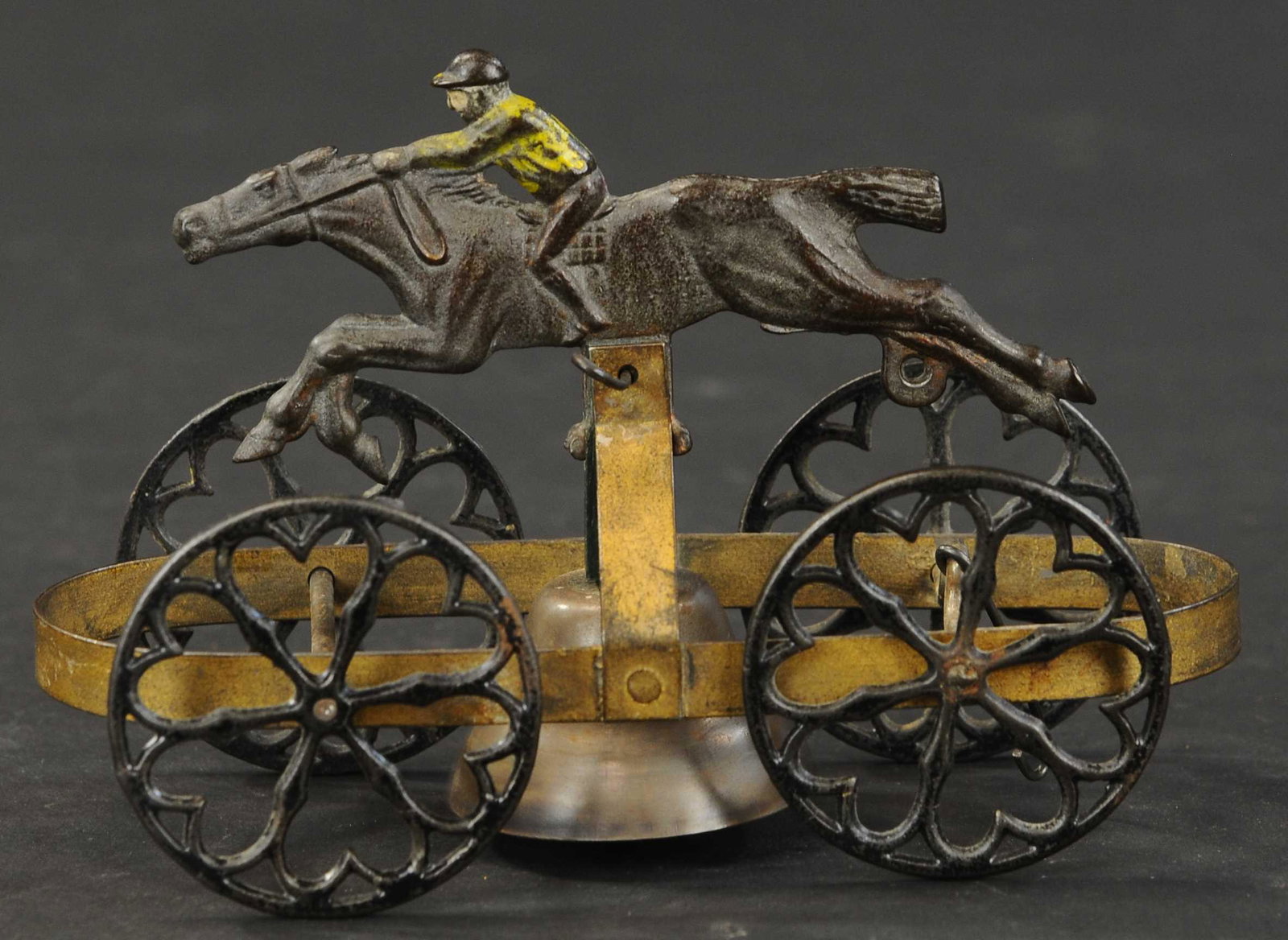 STEEPLECHASE BELL TOY: 2364. STEEPLECHASE BELL TOY | 7" l. | (Very Good Condition) | $200 - $300 | Provenance: Sam Downey Collection.