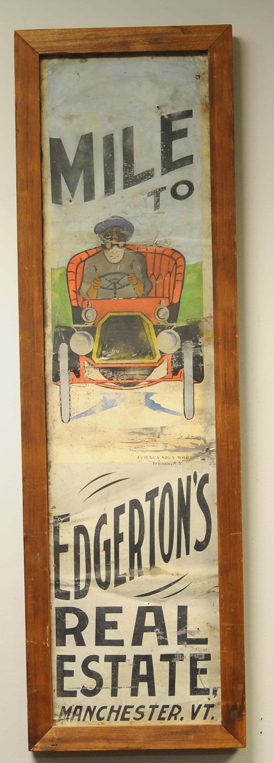 METAL REAL ESTATE SIGN WITH OPEN TOURING CAR: 2404. METAL REAL ESTATE SIGN WITH OPEN TOURING CAR | Screen print on tin by Ithaca Sign Works. Sign 48" x 12" | Several nail holds & some loss of paint throughout, (Good Condition) | $500 - $1,000 | P