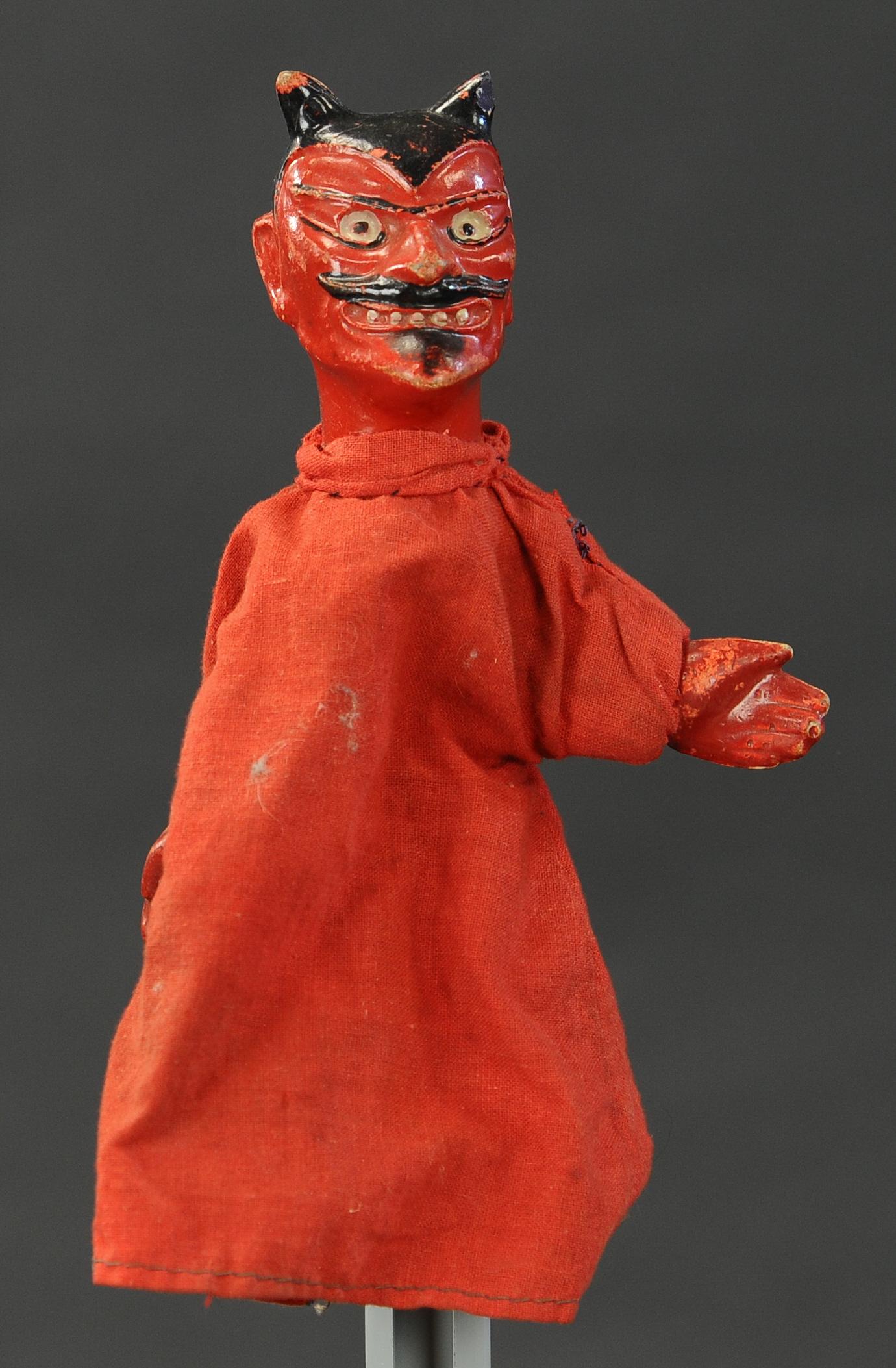 DEVIL FINGER PUPPET: 2494. DEVIL FINGER PUPPET | Composition head & hands, cloth body. 8" h. | (Very Good Condition) | $150 - $300 | Provenance: Sam Downey Collection.