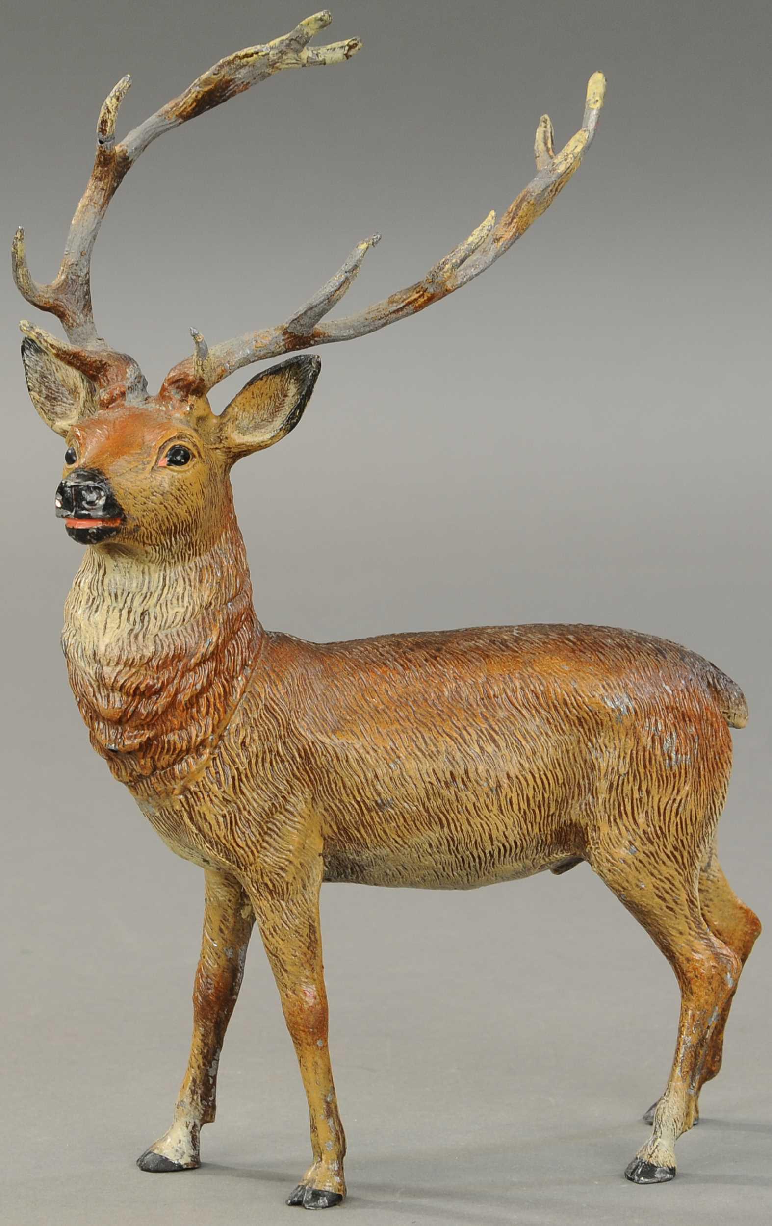 LARGE SPELTER REINDEER: 2513. LARGE SPELTER REINDEER | Large and magnificent metal reindeer w/very impressive looking antlers and good strong colors, great detail throughout. 13" h. | (Excellent Cond.) | $300 - $500
