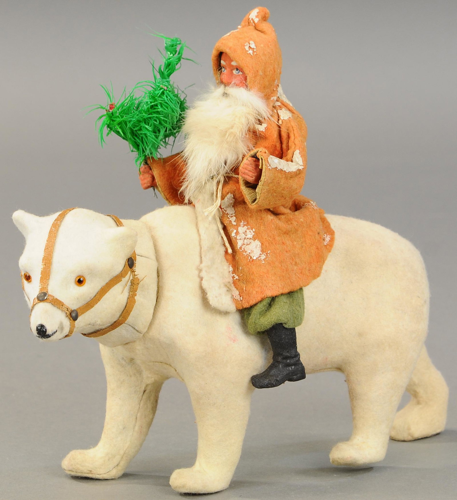 POLAR BEAR WITH RED ROBE SANTA CANDY CONTAINER: 2522. POLAR BEAR WITH RED ROBE SANTA CANDY CONTAINER | Composition Santa Claus w/rabbit fur beard, sitting atop a very well molded, fuzzy white polar bear w/harness and brown glass eyes, head removes 