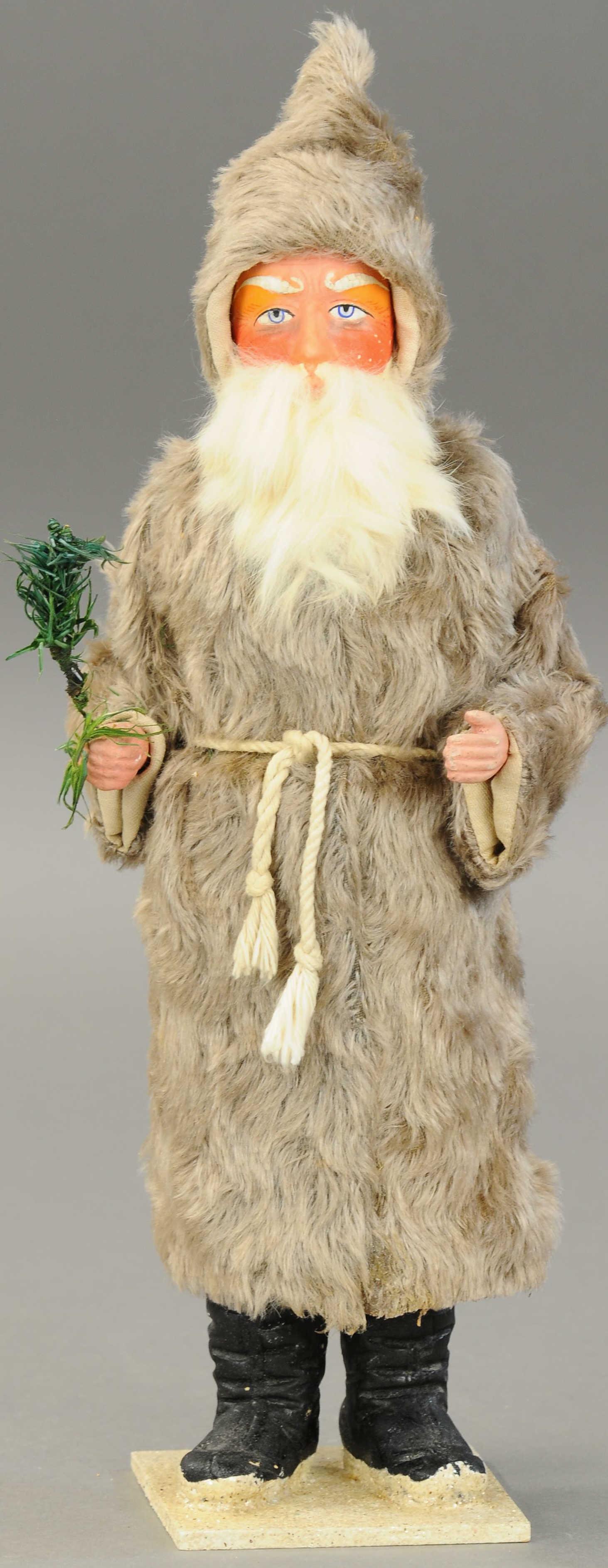 FUR ROBE SANTA CANDY CONTAINER: 2533. FUR ROBE SANTA CANDY CONTAINER | Furry grey mohair robe Santa Claus, seldom seen example, made in Germany, composition & cardboard tube construction, rabbit fur beard, separates at base for cand