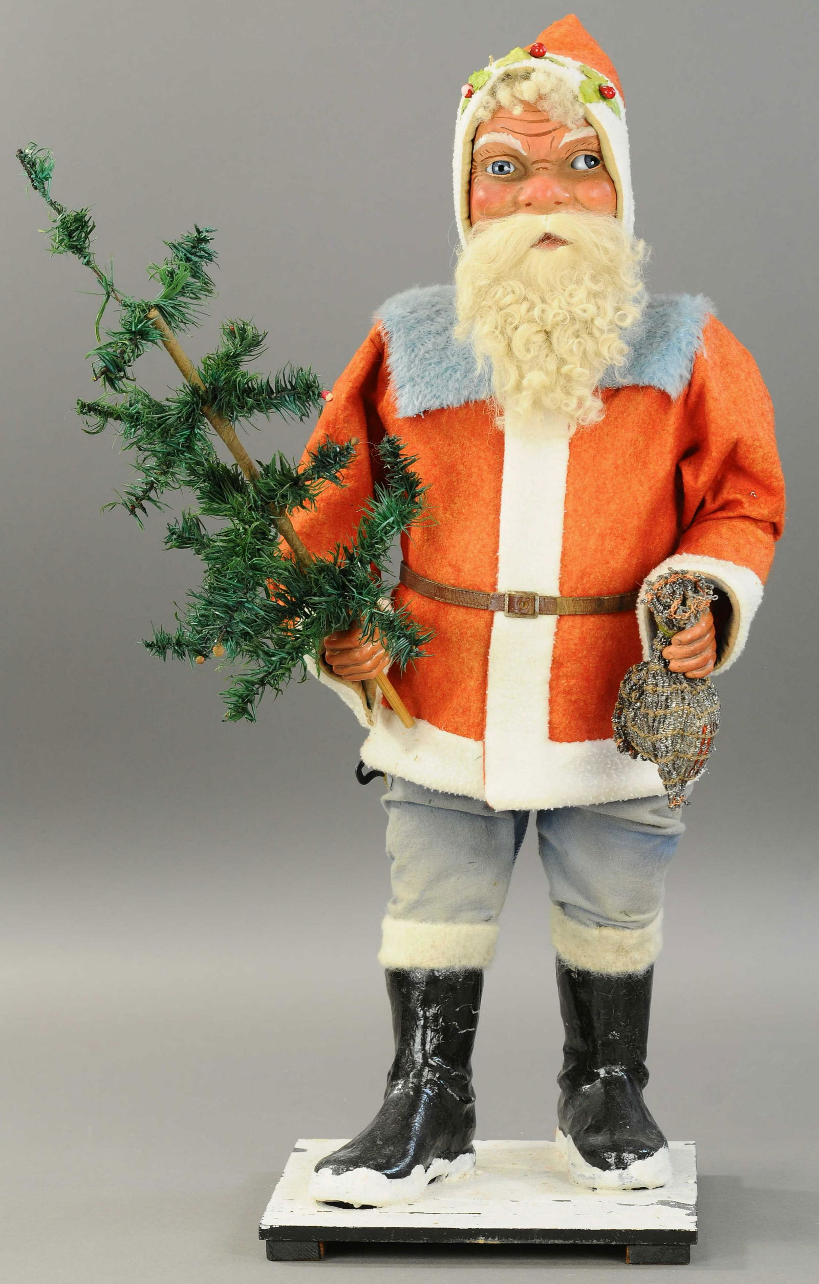 MAGNIFICENT TRADE STIMULATOR SANTA CLAUS: 2565. MAGNIFICENT TRADE STIMULATOR SANTA CLAUS | A large mechanical and jolly St. Nick, most likely a store display, heavy duty papier mache & composition throughout, dressed in a red felt jacket w/wh