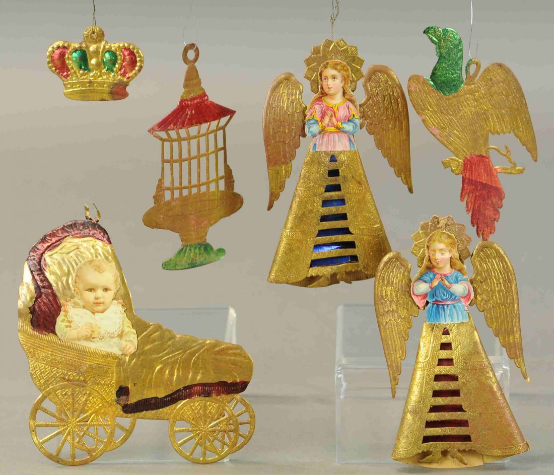 SIX GERMAN DRESDEN CHRISTMAS TREE ORNAMENTS: 2622. SIX GERMAN DRESDEN CHRISTMAS TREE ORNAMENTS | Two praying Angels, flat crown, bird and bird house; baby in coach, part of bird stand is missing. | 2.5"-6". | (VG-Exc. Cond.) | 300 - 600