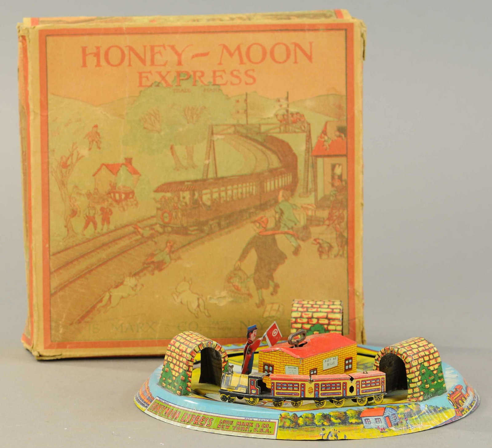 BOXED MARX HONEYMOON EXPRESS W/FLAGMAN: 68. BOXED MARX HONEYMOON EXPRESS W/FLAGMAN | 9.5" l. | Missing two flaps, otherwise in All Original Condition. | $100 - $200