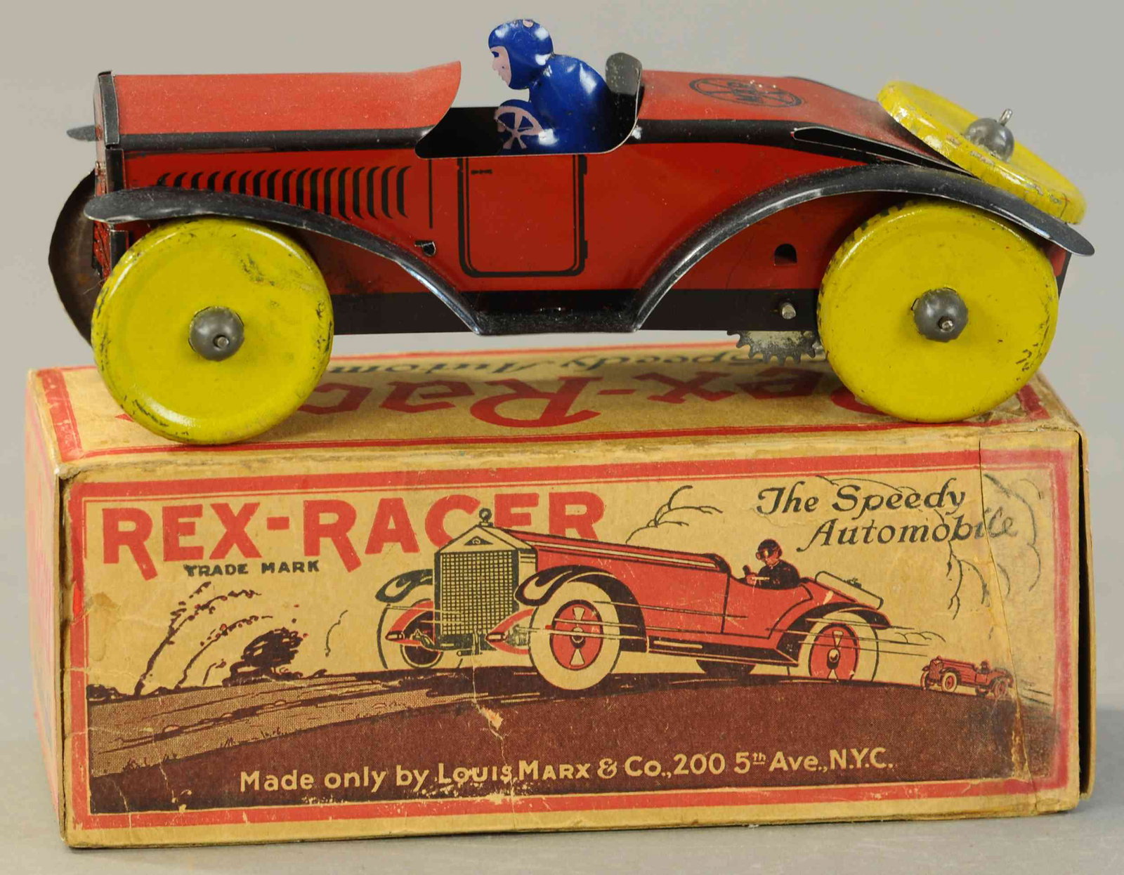 BOXED MARX REX RACER W/DRIVER: 138. BOXED MARX REX RACER W/DRIVER | 9" l. | End flaps replaced, minor tear on box, otherwise in All Original Condition. | $250 - $500