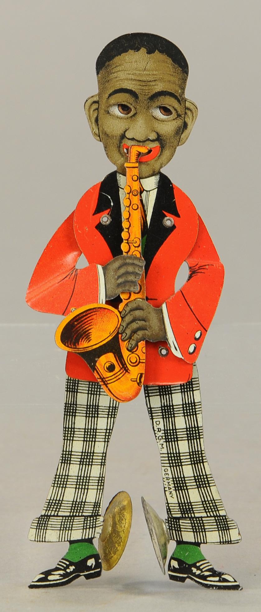 JAZZ PLAYER SQUEEZE TOY: 202. JAZZ PLAYER SQUEEZE TOY | 7" l. | All Original Condition. | $50 - $100