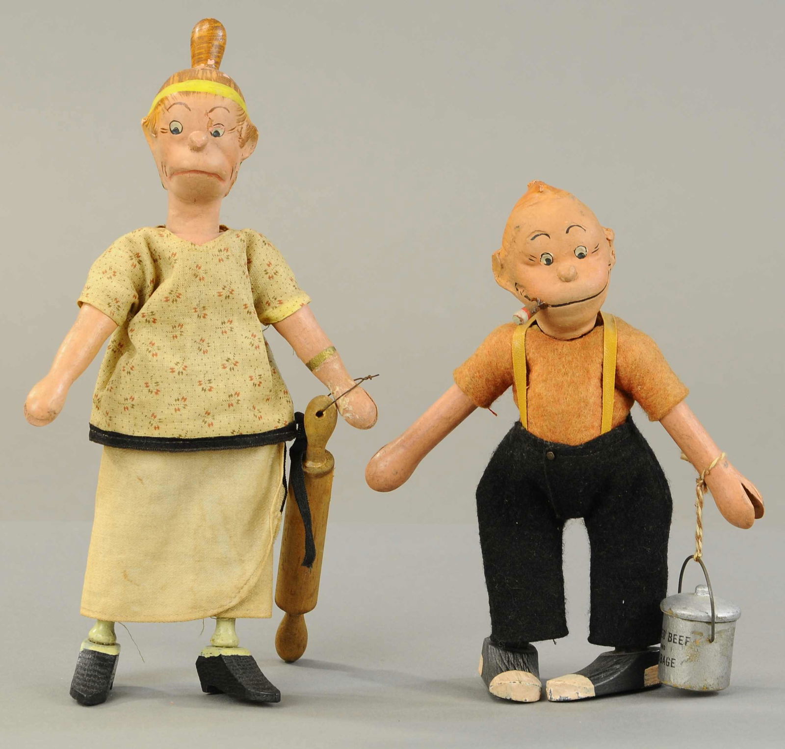 SCHOENHUT MAGGIE & JIGGS FIGURES: 210. SCHOENHUT MAGGIE & JIGGS FIGURES | 7" - 9" h. | Rolling pin replaced, otherwise in All Original Condition. | $200 - $400