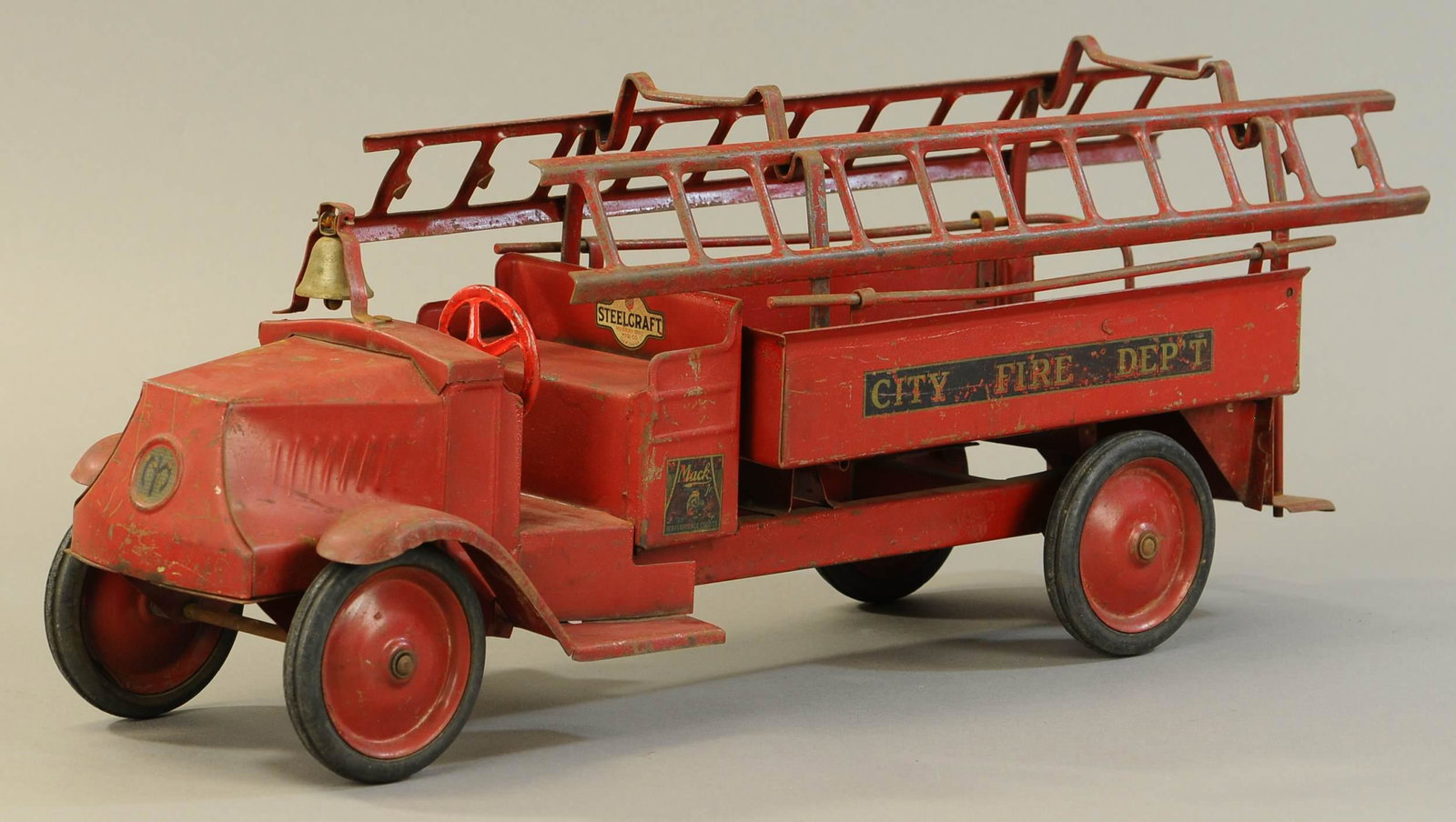 STEELCRAFT CITY FIRE TRUCK: 265. STEELCRAFT CITY FIRE TRUCK | 24" l. | Steering wheel is replaced, fender weld detached at one spot, otherwise All Original Condition. | $500 - $1,000