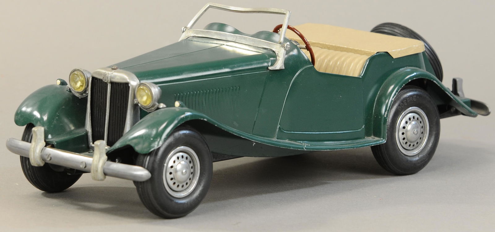 DOEPKE MODEL TOYS MG CONVERTIBLE: 285. DOEPKE MODEL TOYS MG CONVERTIBLE | 16" l. | Windshield has slight bend and break at one post, corner of rear fender chipped. | $75 - $150