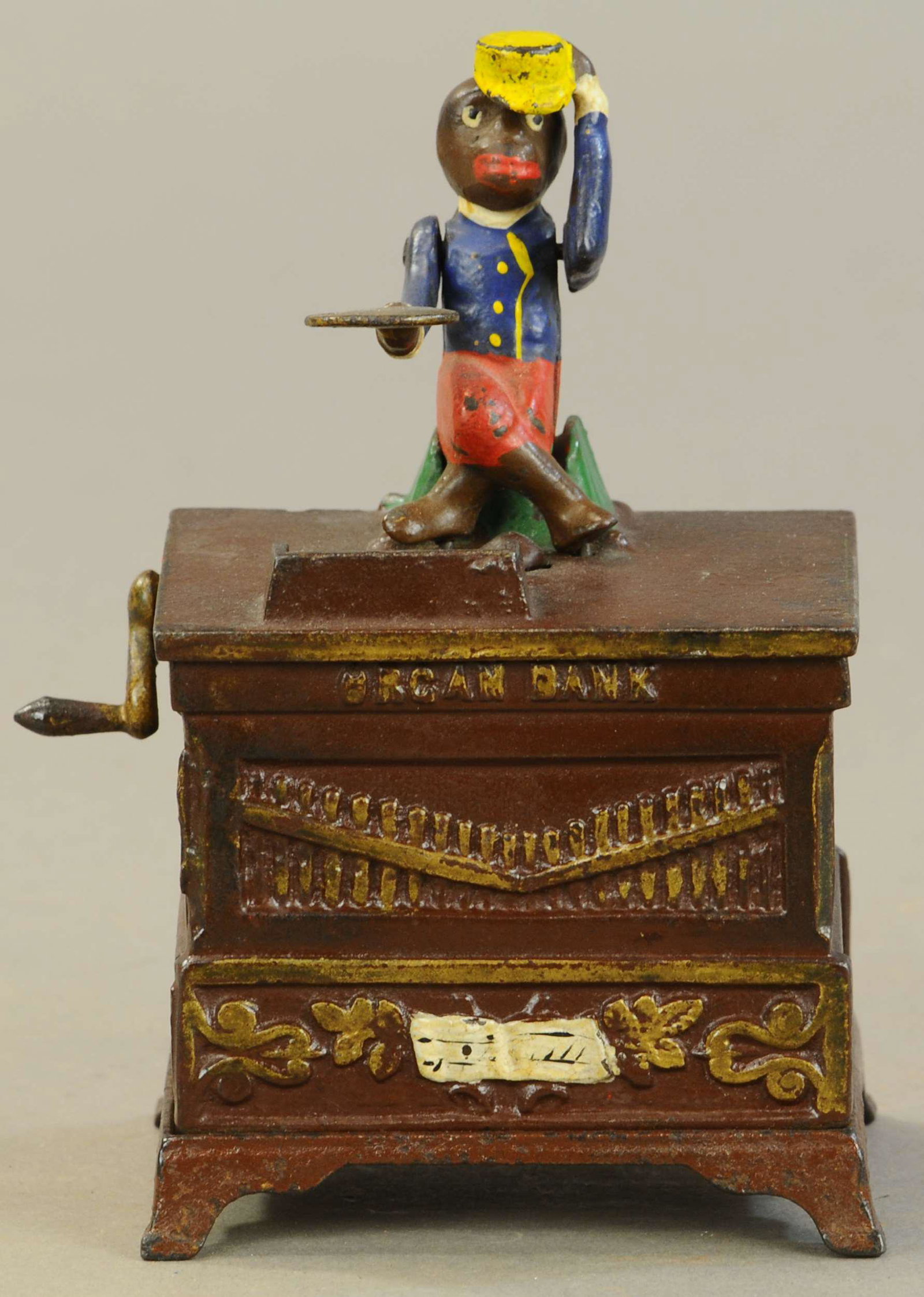 SMALL ORGAN BANK MECHANICAL BANK: 158. SMALL ORGAN BANK MECHANICAL BANK | Base & crank are replaced, touch-up to edges of top plate, monkey appears to be varnished. | $200 - $400