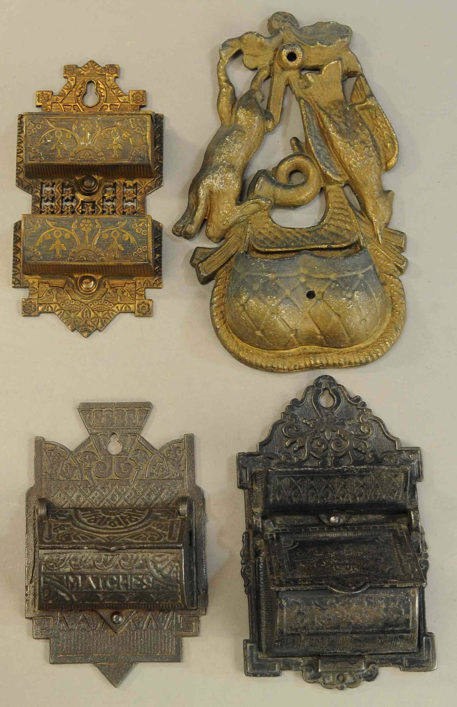FOUR CAST IRON MATCH HOLDERS: 181. FOUR CAST IRON MATCH HOLDERS | 6" - 8" l. | All Original Condition. | $200 - $400