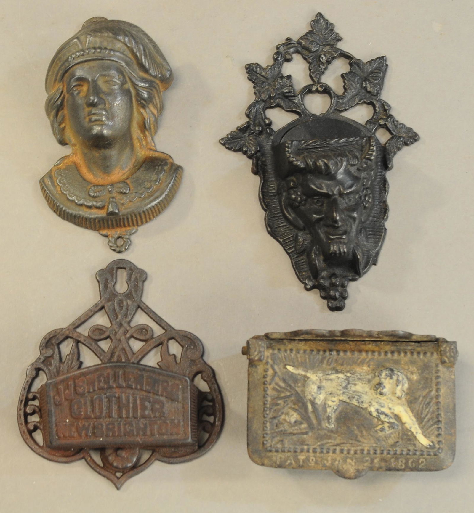 FOUR CAST IRON MATCH HOLDERS: 182. FOUR CAST IRON MATCH HOLDERS | 4" - 6" l. | All Original Condition. | $150 - $300