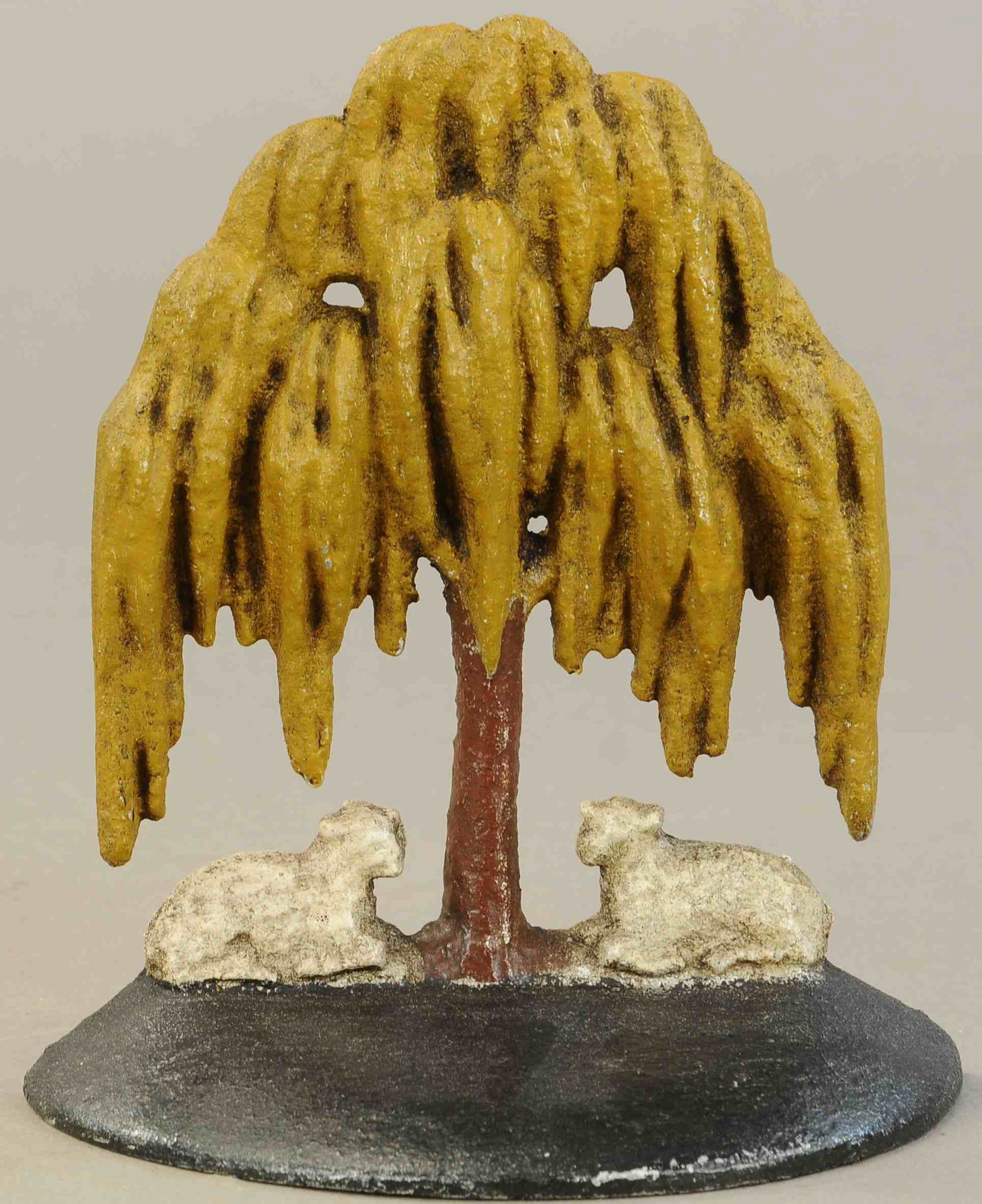 RARE MOURNING TREE DOORSTOP: 189. RARE MOURNING TREE DOORSTOP | 7" h. | Some old repaint, otherwise in All Original Condition. | $200 - $400