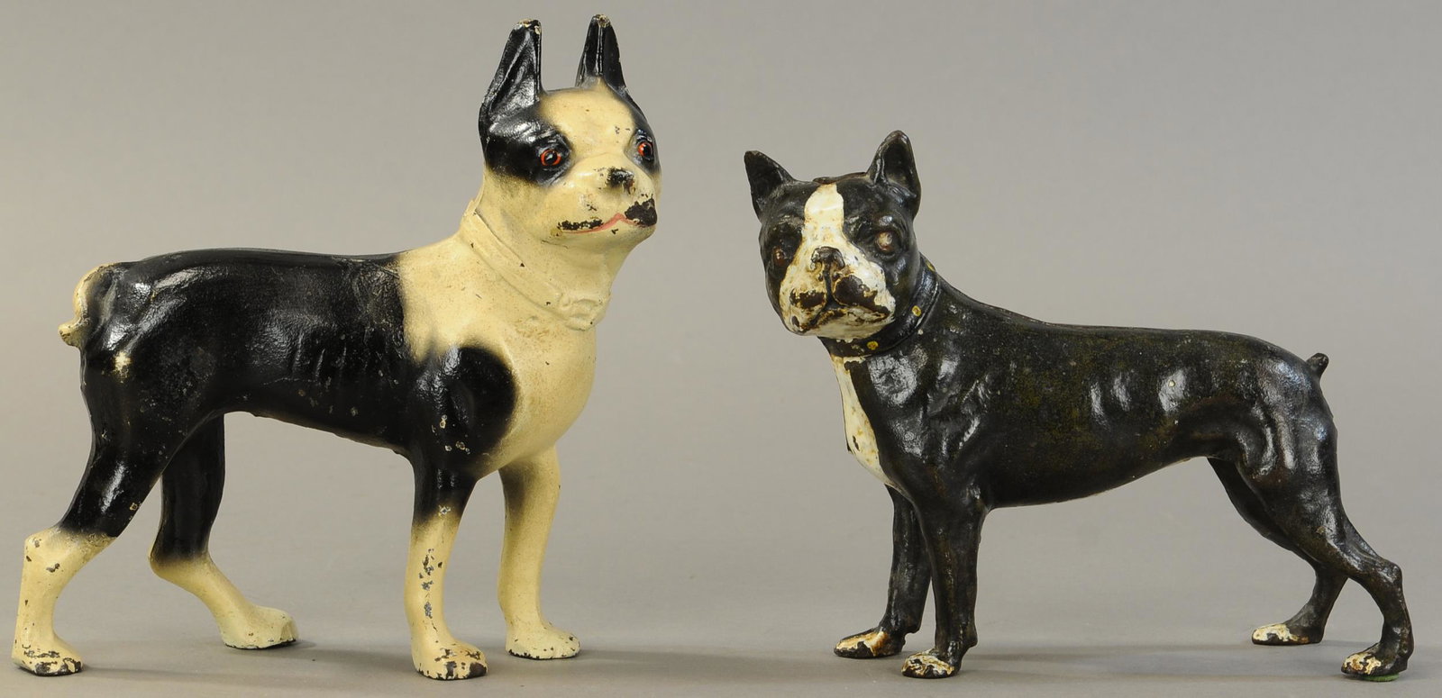 TWO FULL FIGURED BOSTON TERRIER DOORSTOPS: 208. TWO FULL FIGURED BOSTON TERRIER DOORSTOPS | 8" - 8.5" l." h. | All Original Condition. | $200 - $400