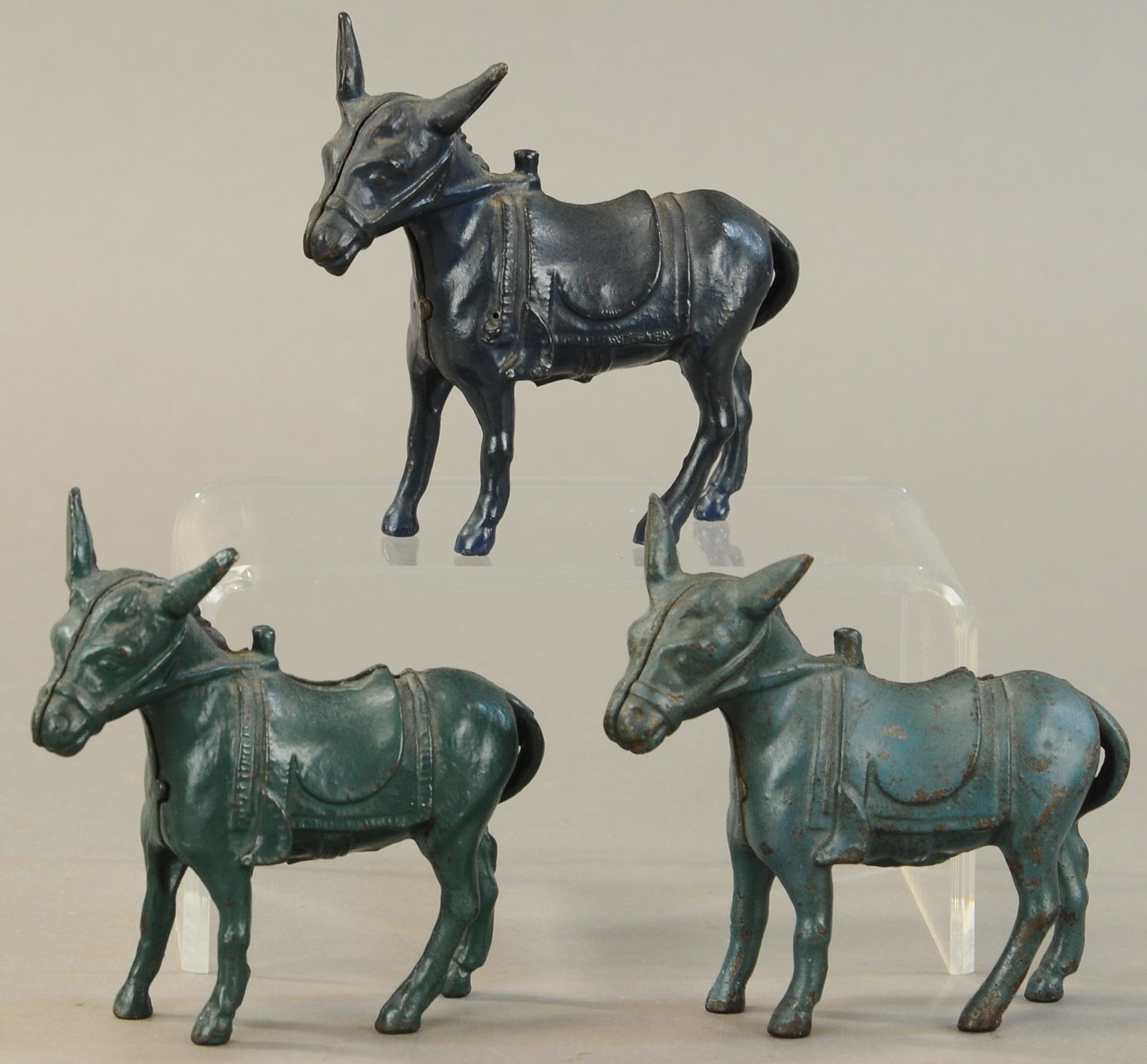 THREE ARCADE DONKEY STILL BANKS: 287. THREE ARCADE DONKEY STILL BANKS | 4.5" l. | All Original Condition. | $150 - $300