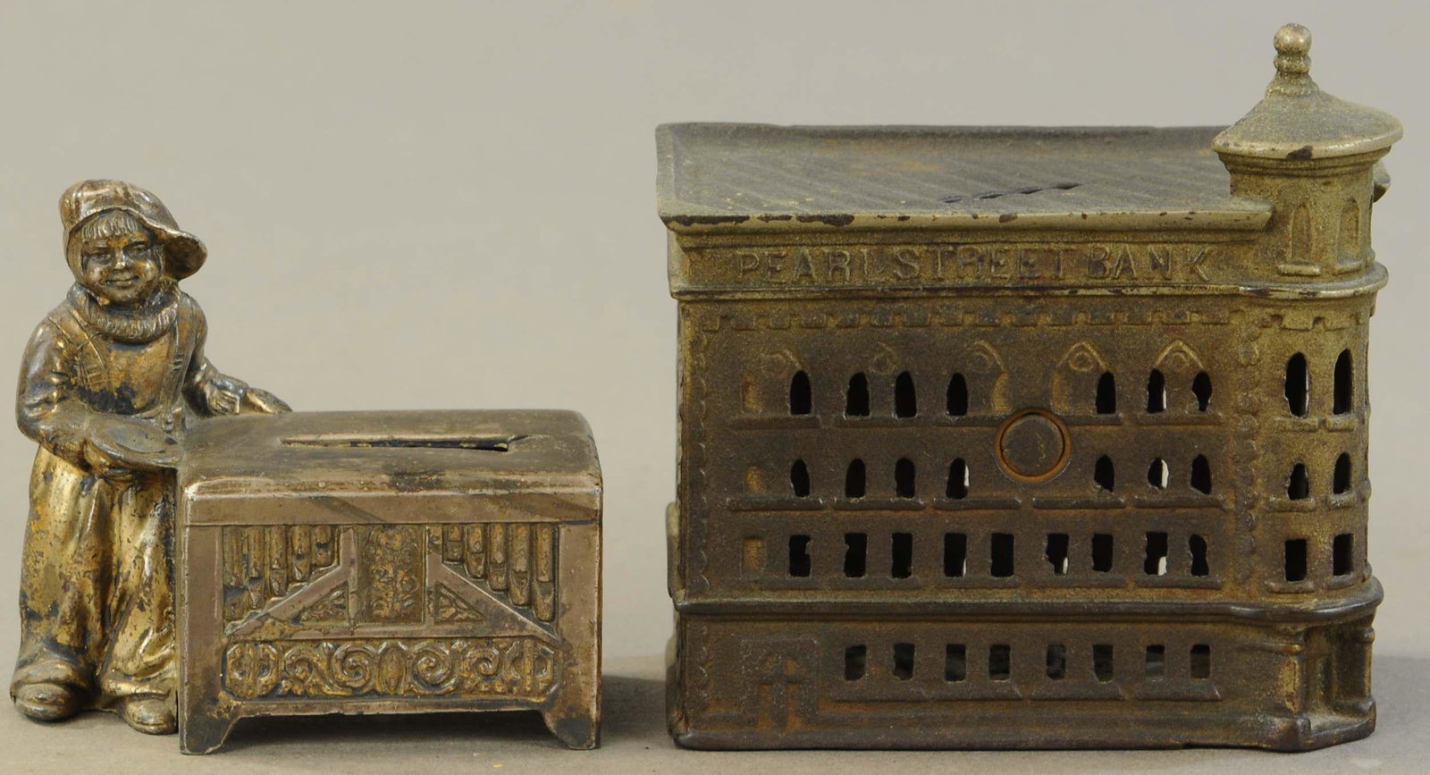 ORGAN BOY W/ PEARL STREET STILL BANKS: 293. ORGAN BOY W/ PEARL STREET STILL BANKS | 3.5" - 4.5" h. | Both in All Original Condition. | $300 - $600