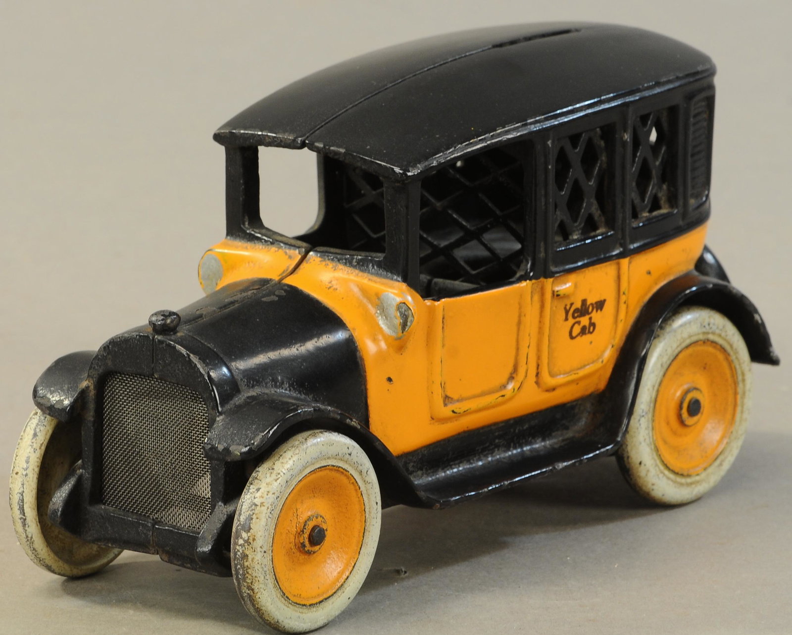 ARCADE YELLOW CAB STILL BANK: 296. ARCADE YELLOW CAB STILL BANK | 8" l. | Missing driver, Restored. | $200 - $400