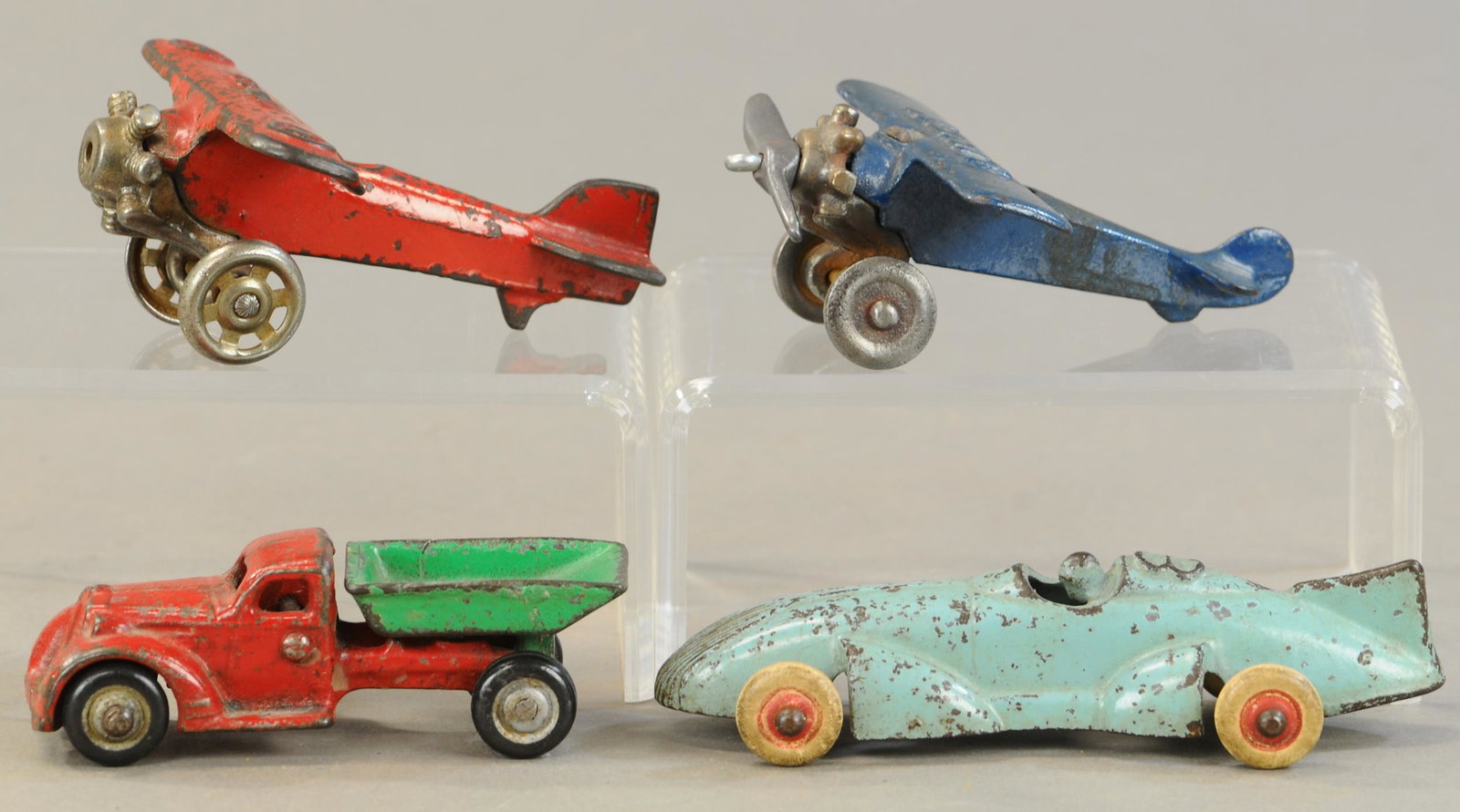 FOUR HUBLEY TOYS: 379. FOUR HUBLEY TOYS | 4.5" - 5.5" l. | Red plane missing propeller, blue plane has replaced propeller, autos in All Original Condition. | $150 - $300