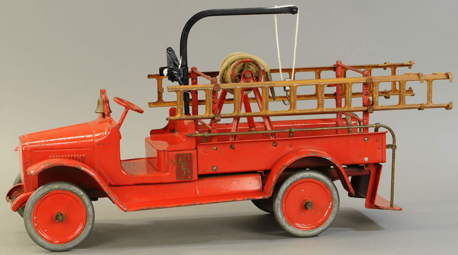 BUDDY L HOOK AND LADDER TRUCK: 416. BUDDY L HOOK AND LADDER TRUCK | 25" l. | Old overpaint. | $250 - $500