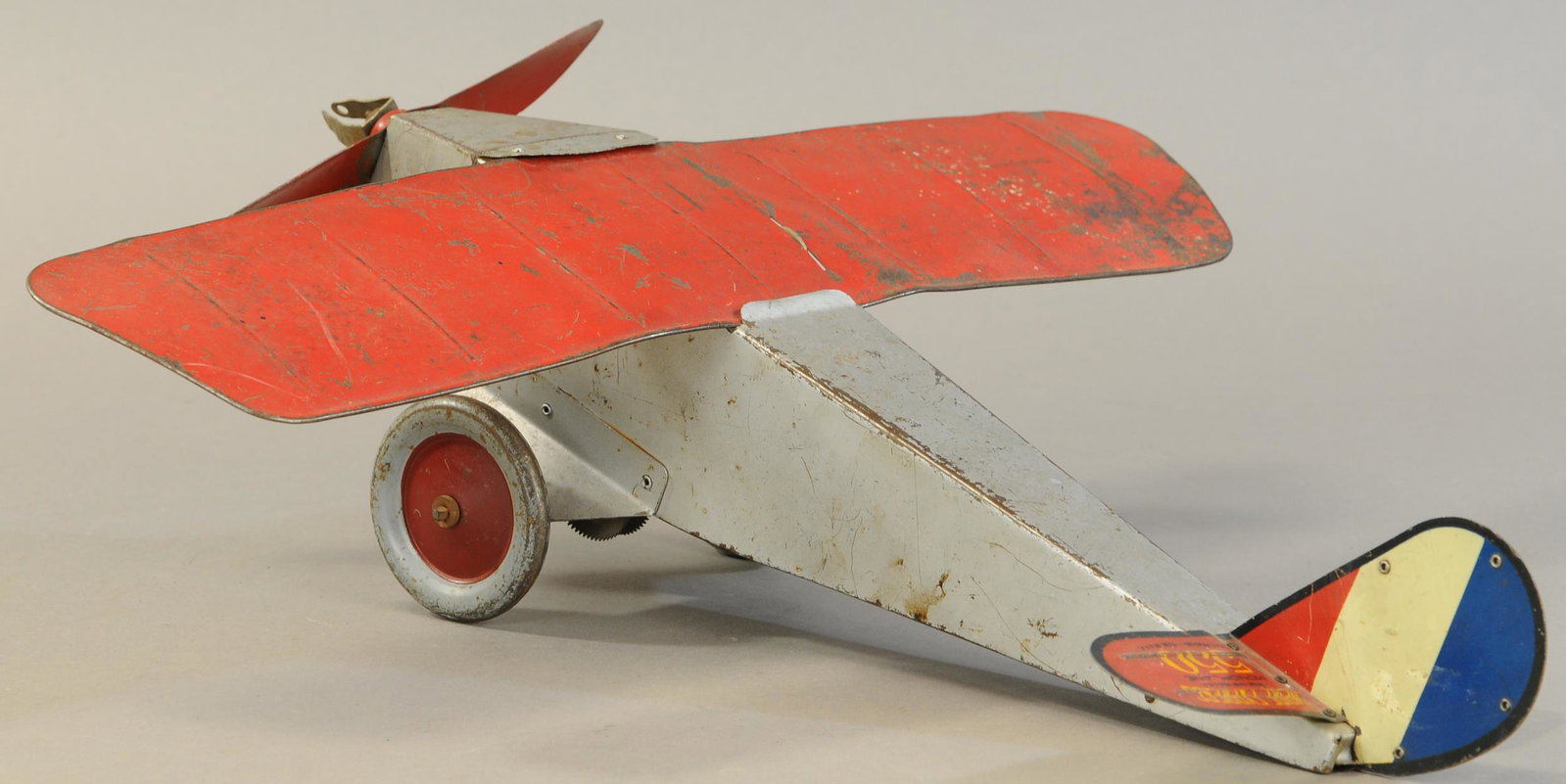 AMERICAN FLYER EMPIRE EXPRESS MONOPLANE: 425. AMERICAN FLYER EMPIRE EXPRESS MONOPLANE | 19" l. | Missing wheel clicker bar, paint is All Original Condition. | $200 - $400